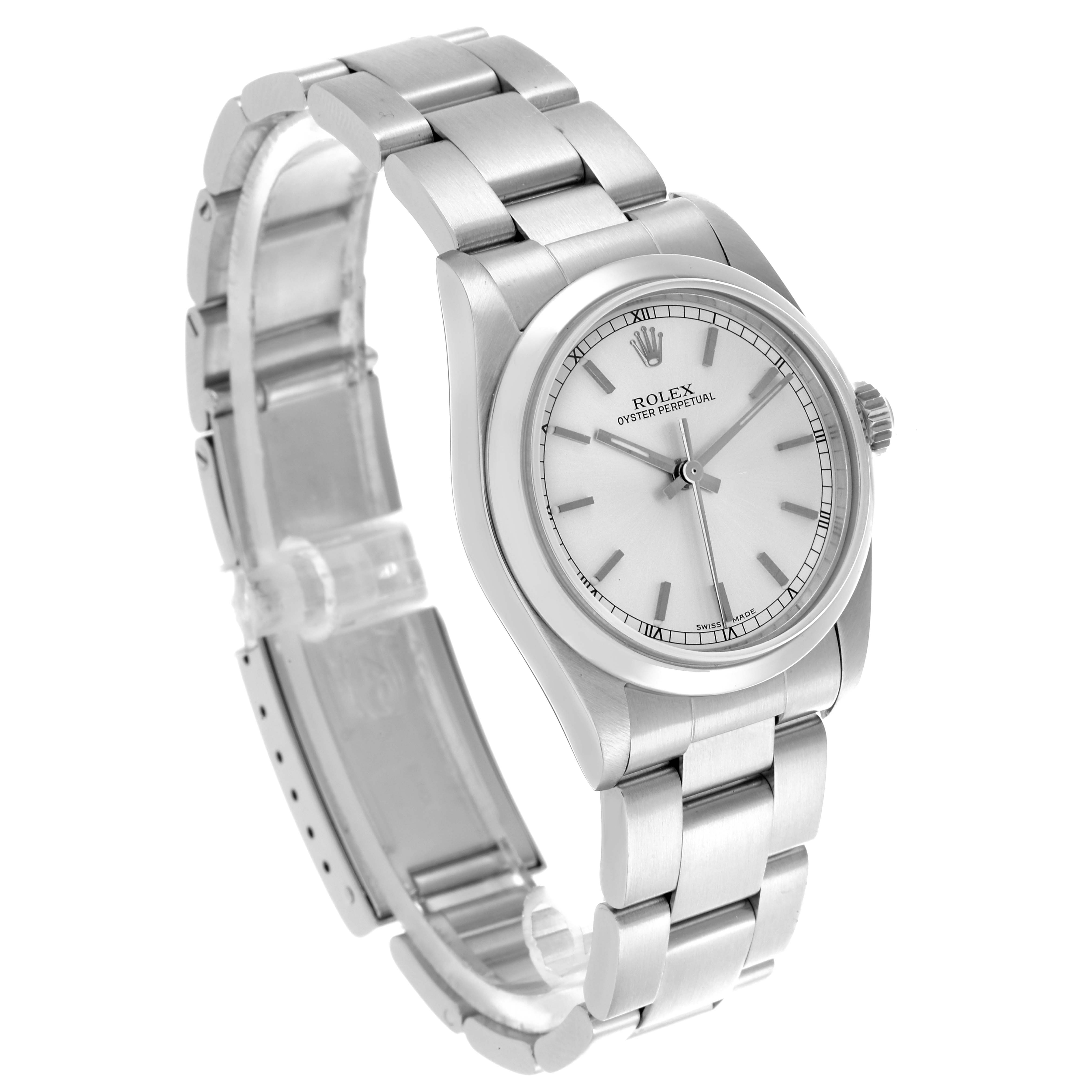 The Rolex Oyster Perpetual Mid-Size watch is shown at a slight angle, highlighting the dial, bezel, and bracelet.