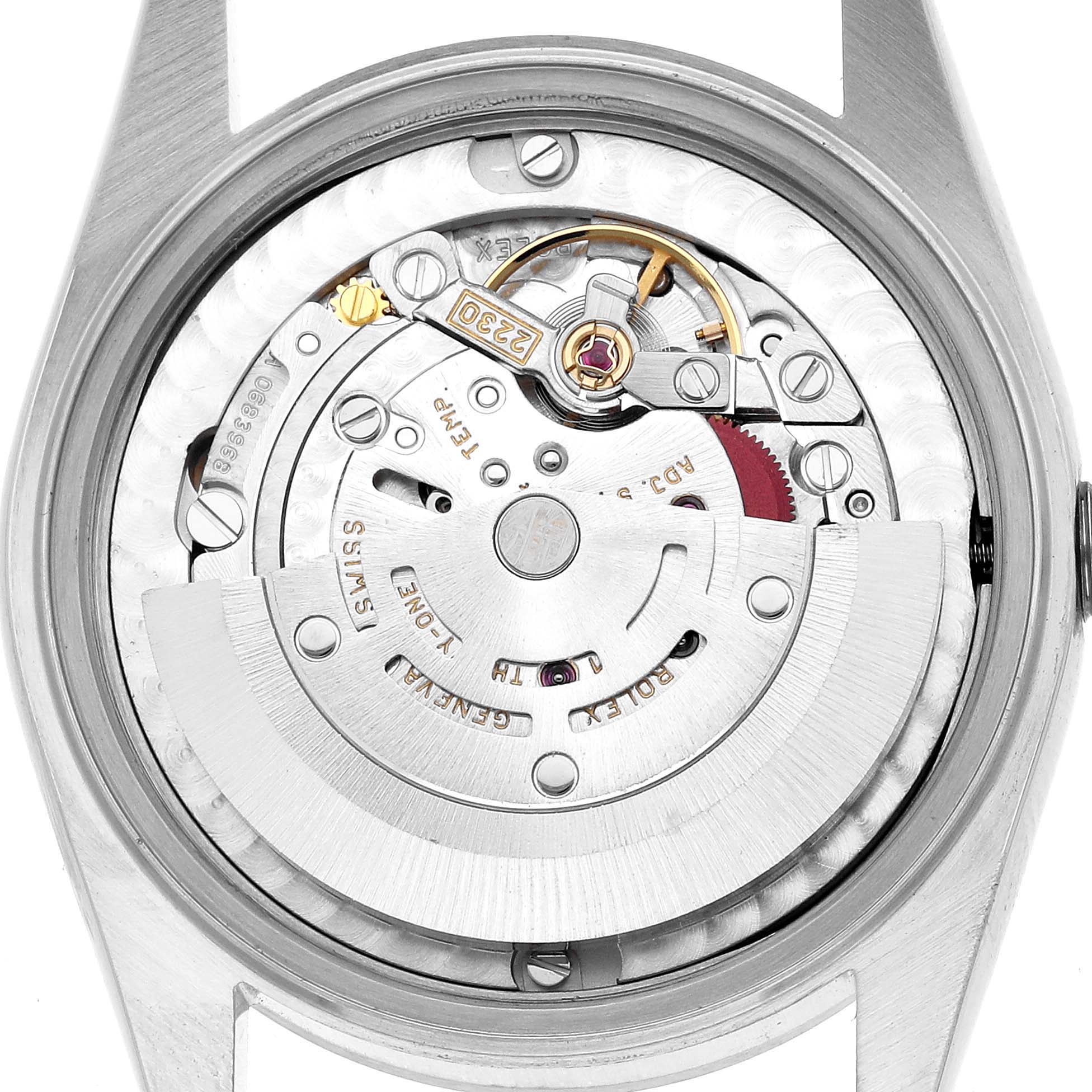 The image shows the movement and internal mechanics of a Rolex Mid-Size 77080 Women's Stainless Steel Silver Dial watch from a back, open case view.