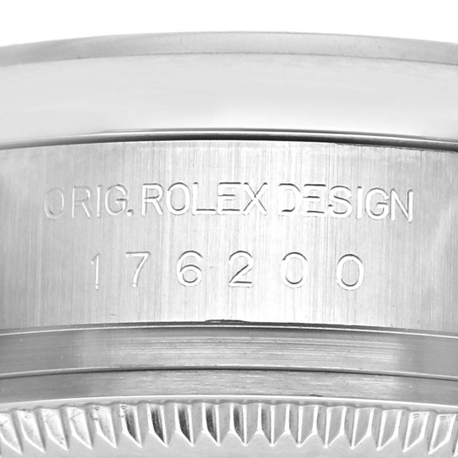 The image shows a close-up view of the side engraving on a Rolex Oyster Perpetual 176200 Women's Stainless Steel White Dial 176200 Women's Stainless Steel White Dial watch, featuring its design number.