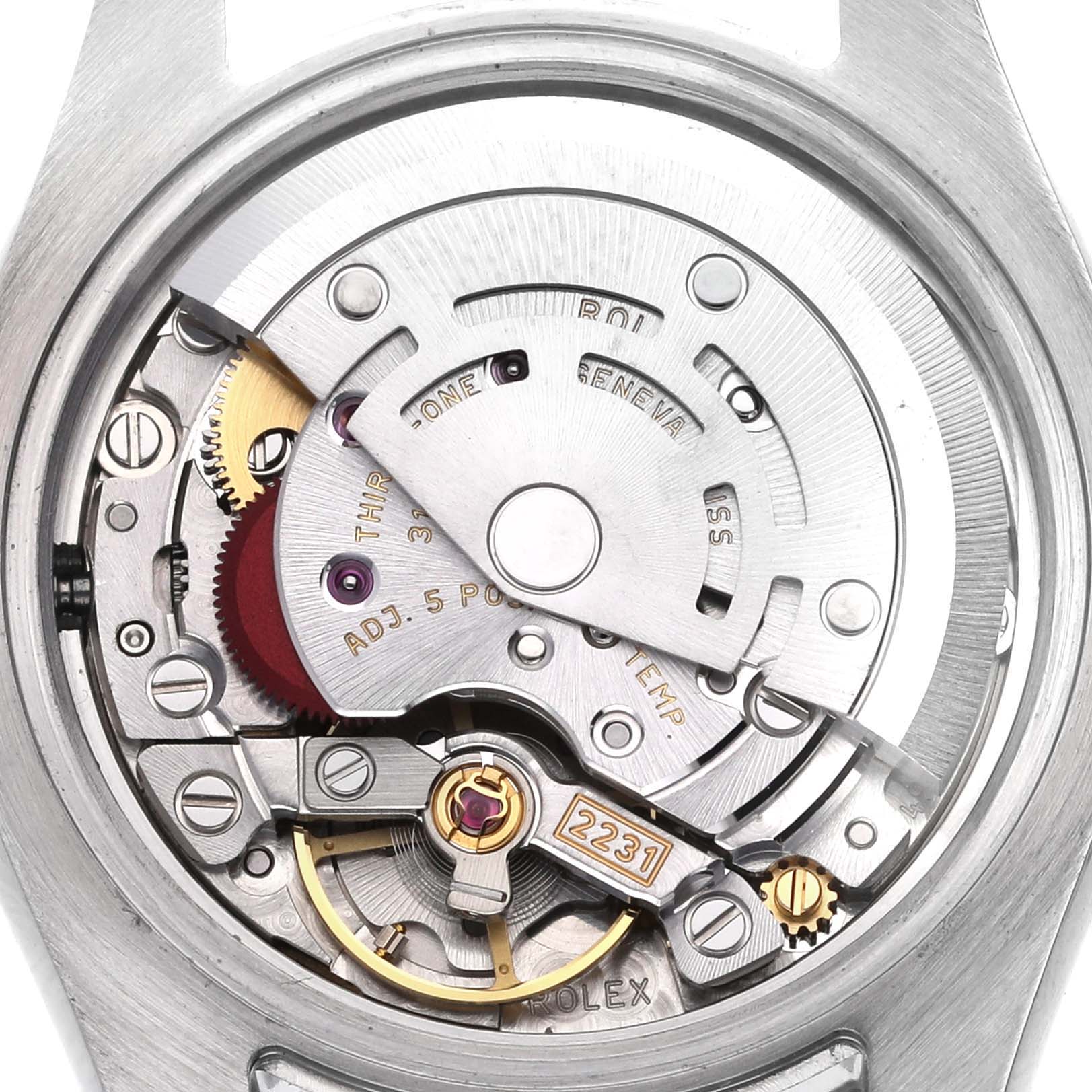 The image shows the movement of a Rolex Oyster Perpetual 176200 Women's Stainless Steel White Dial 176200 Women's Stainless Steel White Dial watch from a top-down angle, highlighting its intricate mechanical parts.