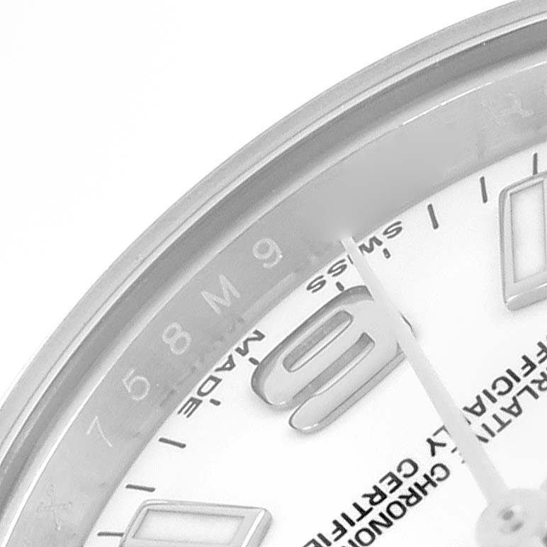 The image shows a close-up angle of the Rolex Oyster Perpetual 176200 Women's Stainless Steel White Dial 176200 Women's Stainless Steel White Dial watch's dial, focusing on the hour markers and hands.