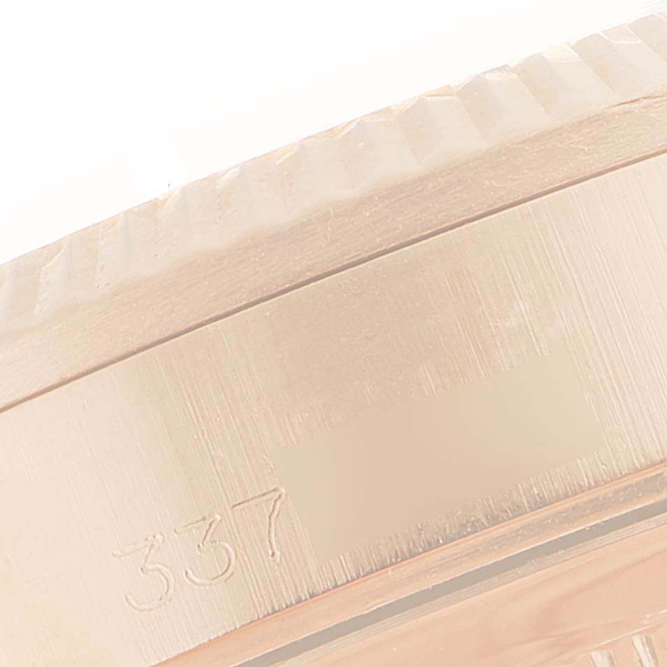 This close-up shows the edge and part of the bezel of a Rolex President 6827 Women's Rose Gold White Dial 6827 Women's Rose Gold White Dial model watch with markings.