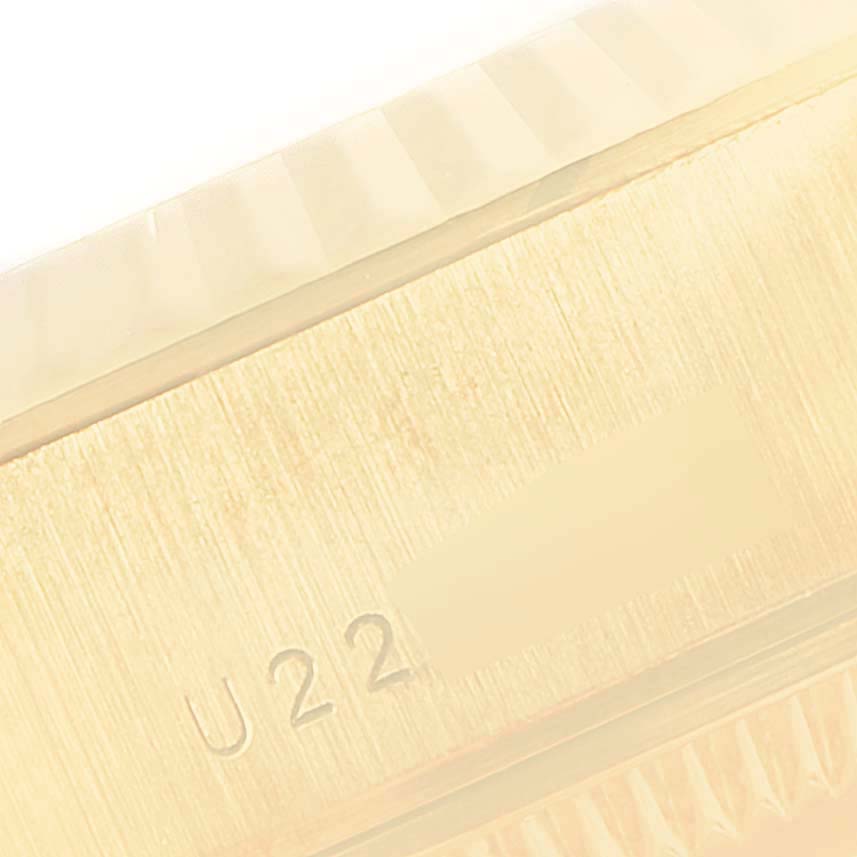 This close-up image shows the engraving on the side of the case of a Rolex President 79178 Women
s Yellow Gold Champagne Dial 79178 Women
s Yellow Gold Champagne Dial model watch.