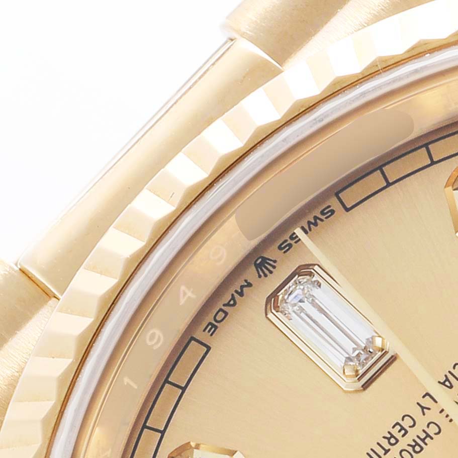 The image shows a close-up of the dial, bezel, and part of the bracelet of a Rolex President 128238 Men's Yellow Gold Champagne Dial model.