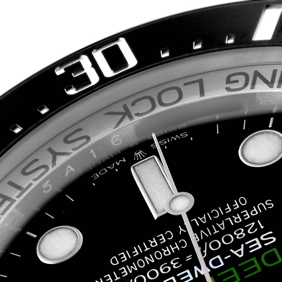 The image shows a close-up angle of the Rolex Sea-Dweller 126660 Men's Stainless Steel Blue Dial watch, highlighting the bezel and part of the dial.