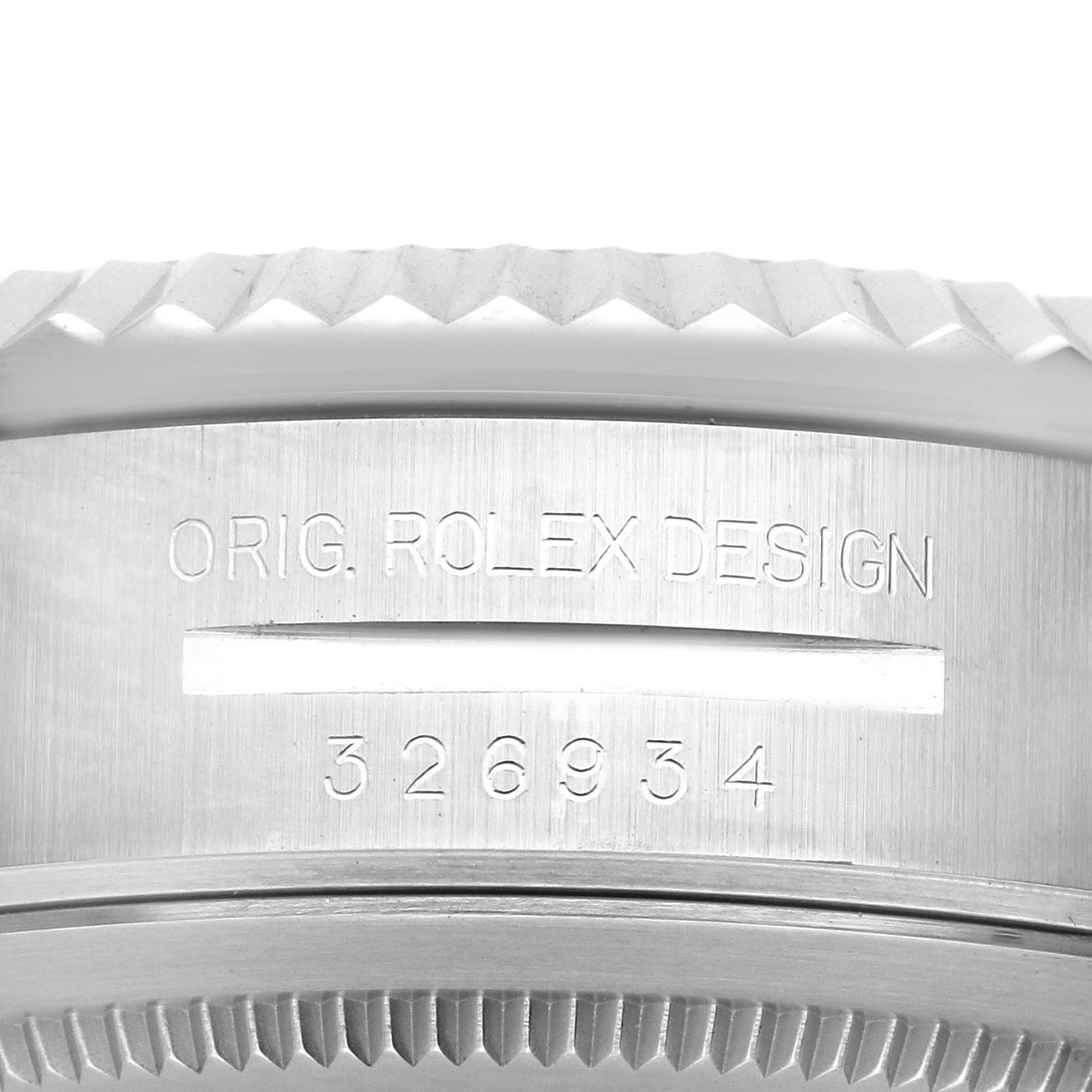 The image shows a close-up of the case side and bezel of a Rolex Sky-Dweller 326934 Men
s Stainless Steel Blue Dial 326934 Men
s Stainless Steel Blue Dial, featuring design engravings.