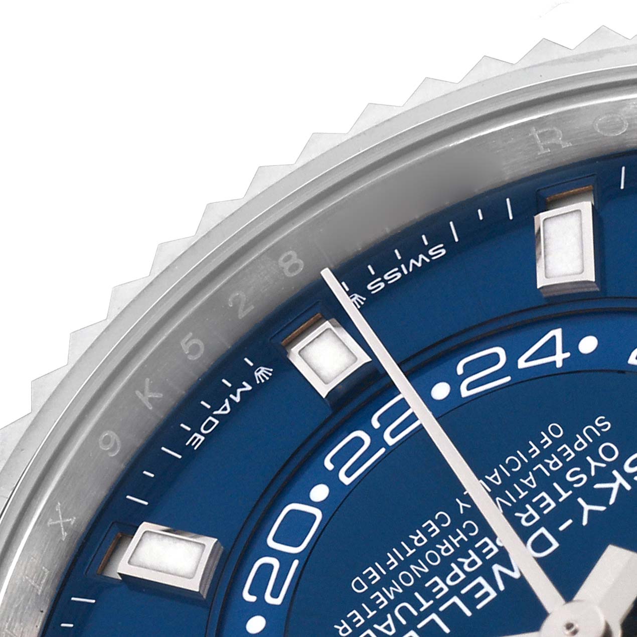 The image shows a close-up of the dial and bezel of a Rolex Sky-Dweller 336934 Men
s Stainless Steel Blue Dial 336934 Men
s Stainless Steel Blue Dial watch at an angle highlighting the blue face and markers.