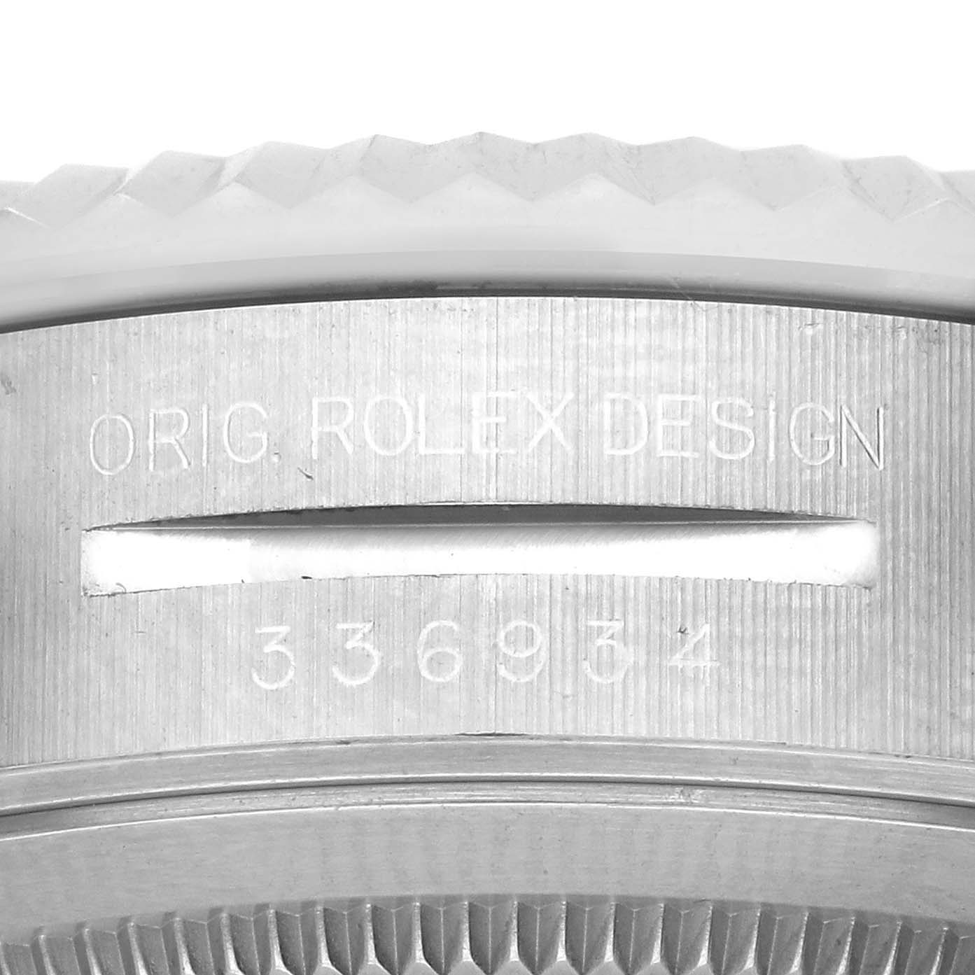 The image shows a close-up of the engraving on the side of the Rolex Sky-Dweller 336934 Men
s Stainless Steel Blue Dial 336934 Men
s Stainless Steel Blue Dial bezel.