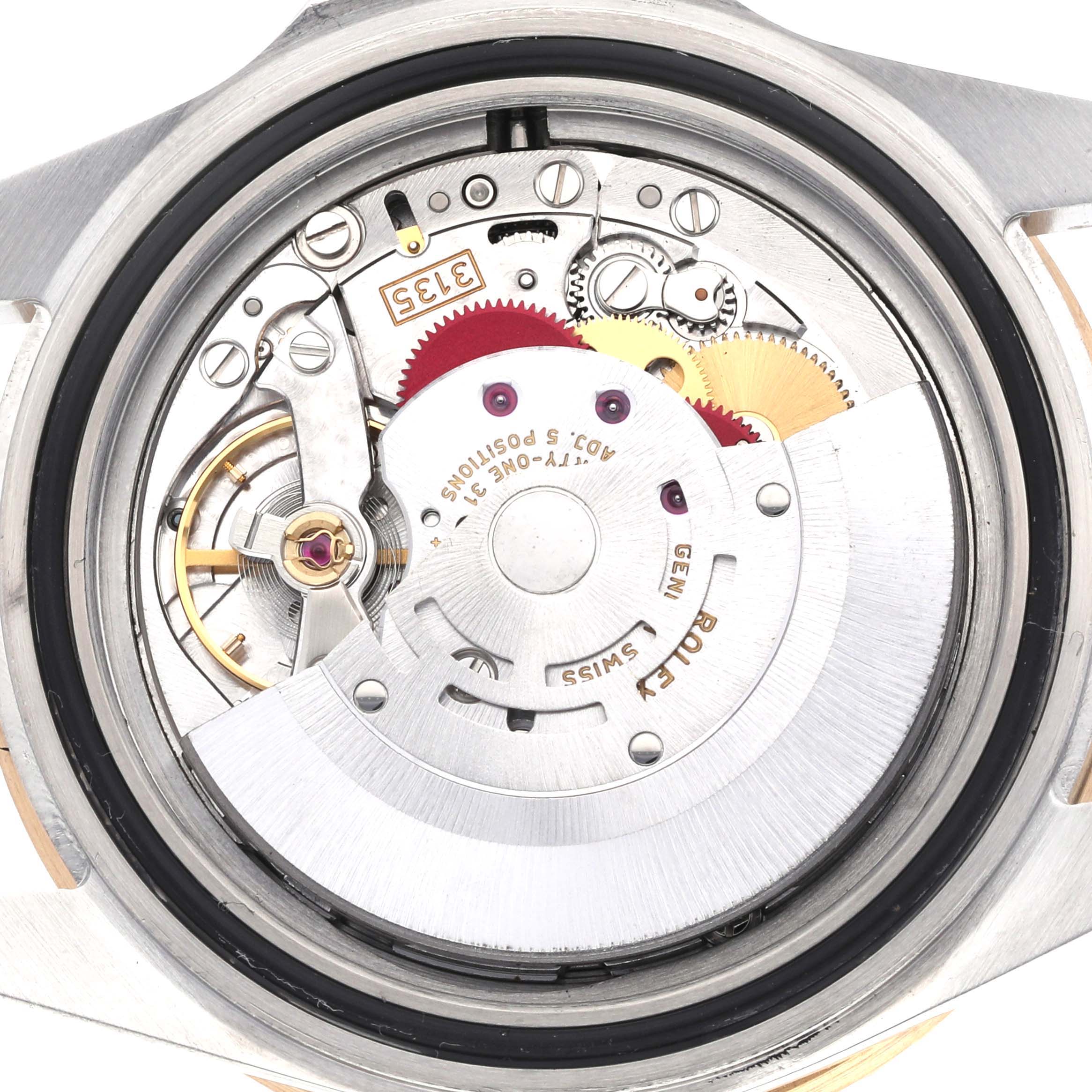The image shows the back view of the Rolex Submariner 16613 Men's Steel and Gold (two tone) Black Dial, highlighting the intricate movement and internal components.