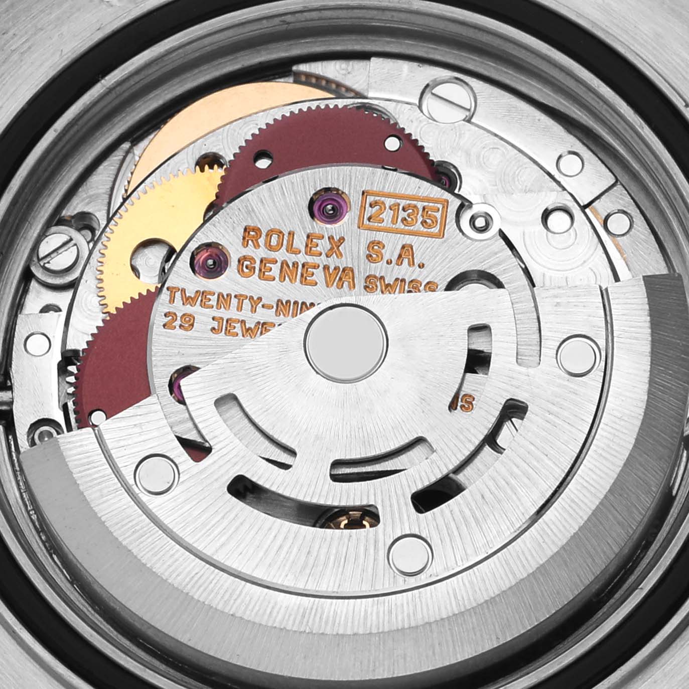 This image shows the movement of the Rolex Yacht-Master 69623 Women
s Steel and Gold (two tone) White Dial 69623 Women
s Steel and Gold (two tone) White Dial watch, highlighting its intricate gears and the rotor from the back.