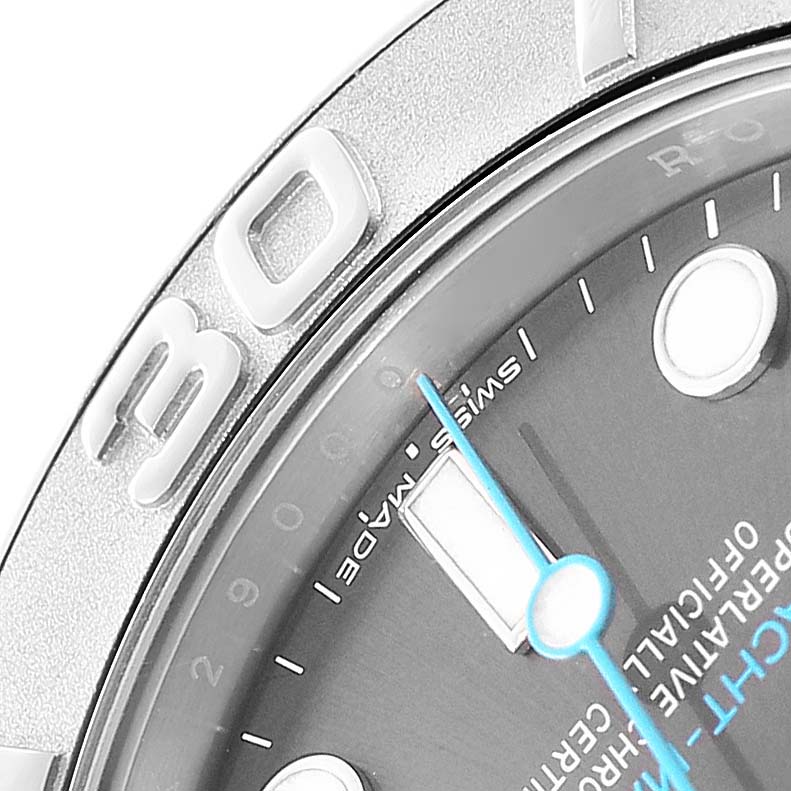 The image shows a close-up of the Rolex Yacht-Master 268622 Men's Stainless Steel Grey Dial, focusing on the bezel, dial, and minute hand at an angled view.