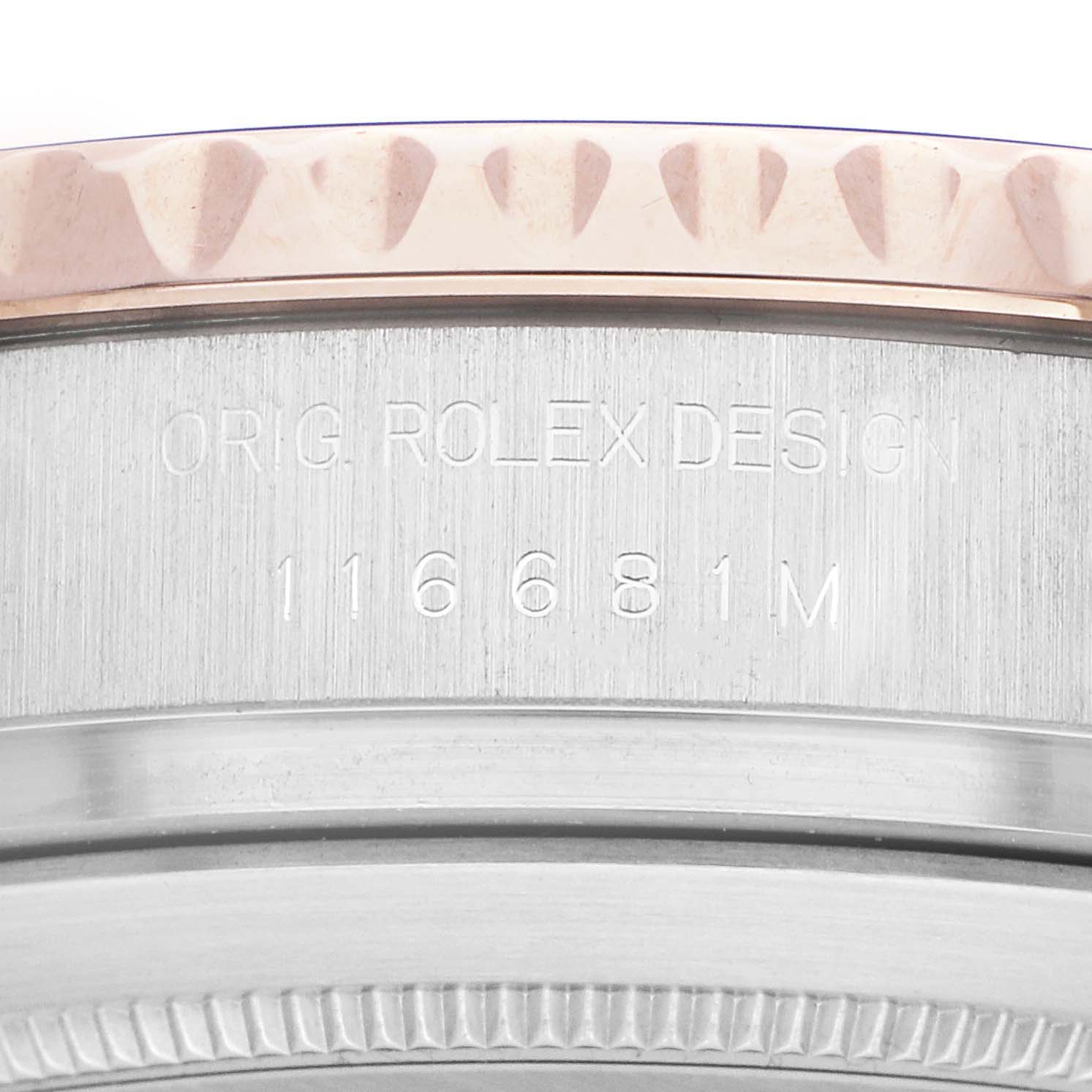 The image shows a close-up of the side of a Rolex Yacht-Master 116681M Men's Steel and Gold (two tone) White Dial watch, focusing on the engraved bezel and case details.