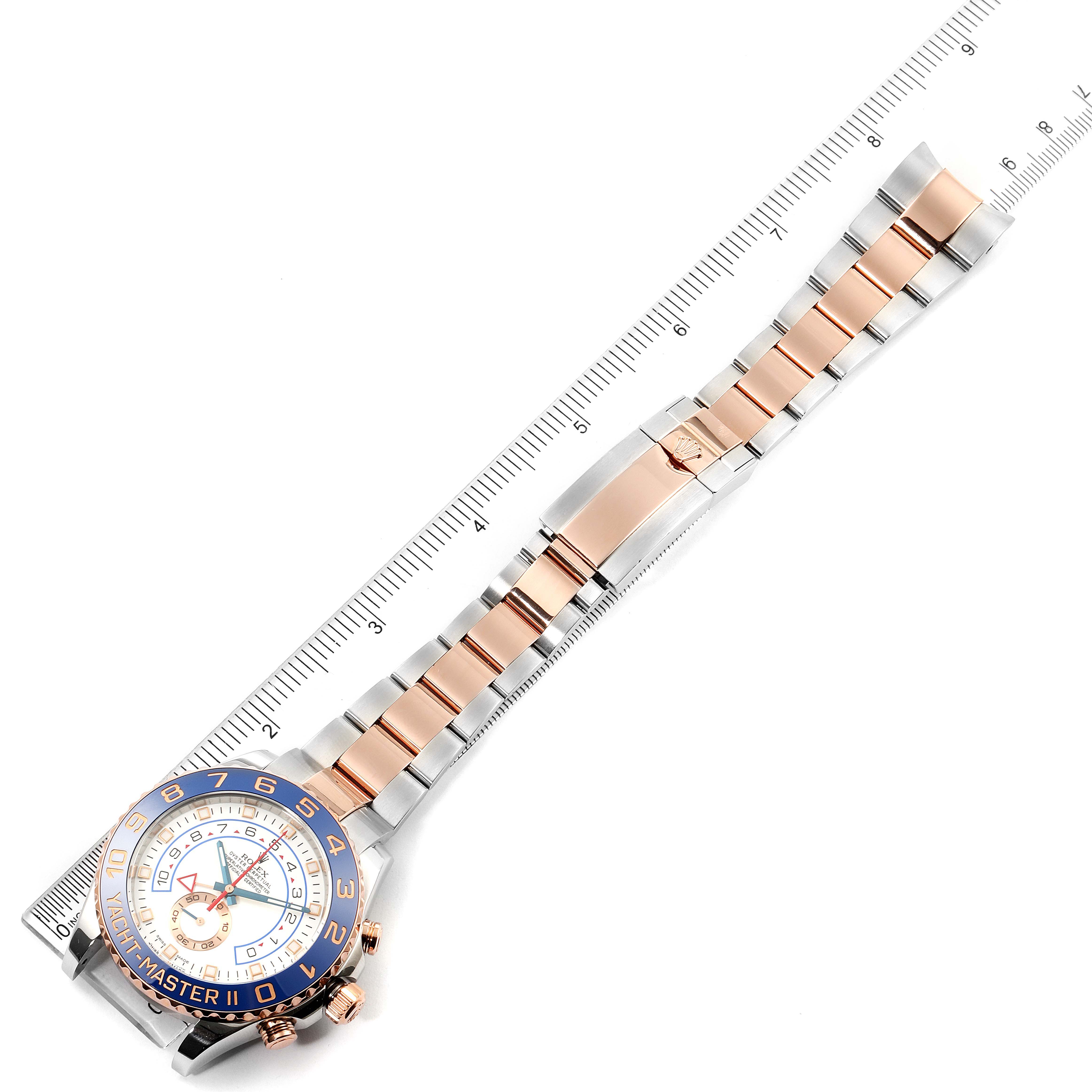 This image shows a top-down view of a Rolex Yacht-Master 116681 Men
s Steel and Gold (two tone) White Dial 116681 Men
s Steel and Gold (two tone) White Dial watch, highlighting the bezel, dial, and full bracelet with a measuring scale.