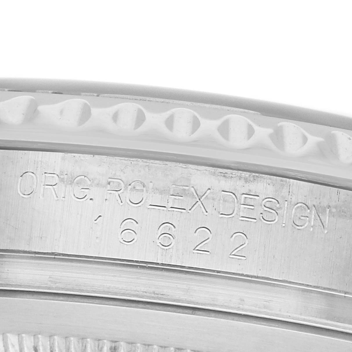 The image shows a close-up of the side of a Rolex Yacht-Master 16622 Men's Stainless Steel Grey Dial watch, focusing on the engraved model number and bezel edge.