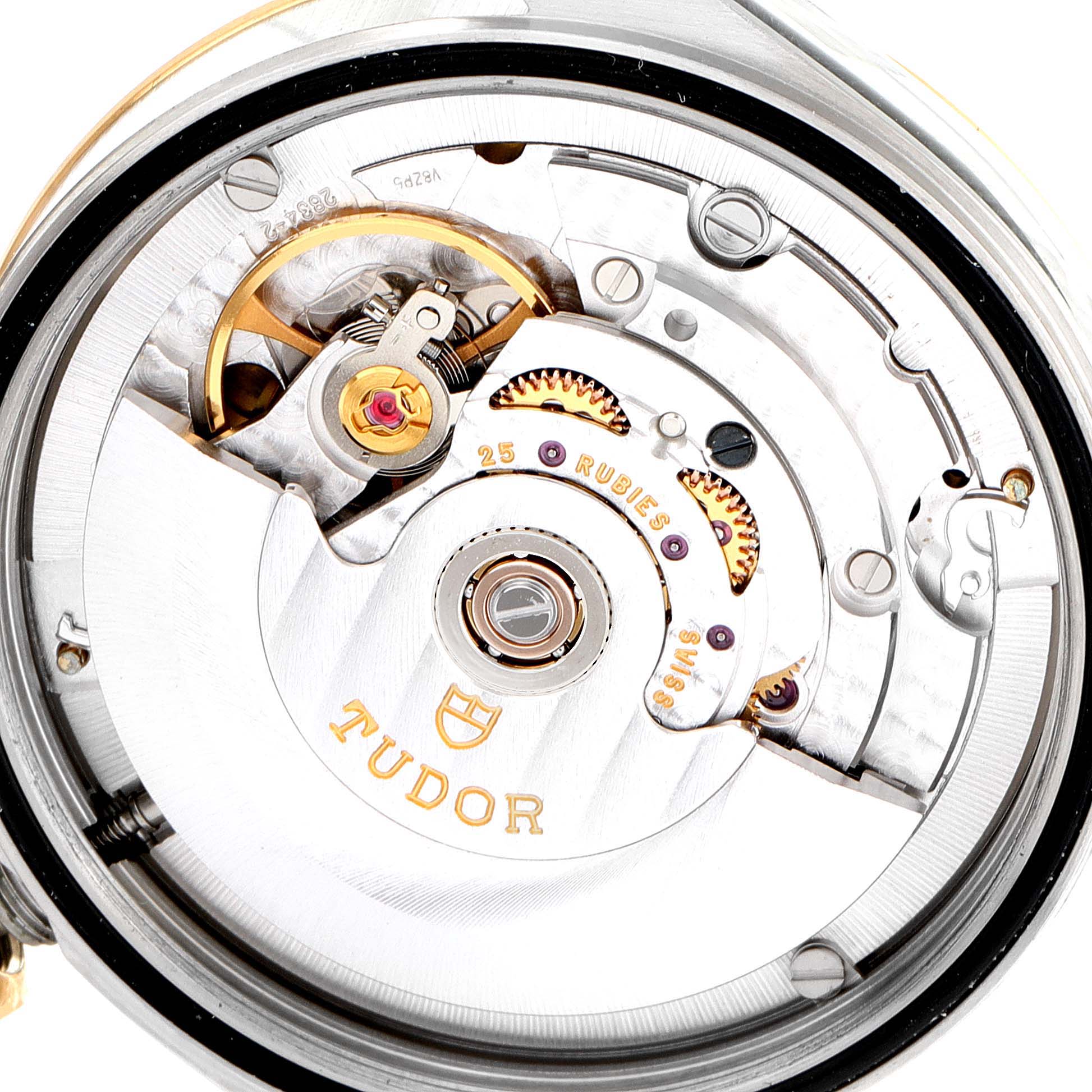 The image shows the movement of a Tudor Prince 76213 Men's Steel and Gold (two tone) Champagne Dial 76213 Men's Steel and Gold (two tone) Champagne Dial watch, highlighting its intricate internal mechanism from a top-down angle.