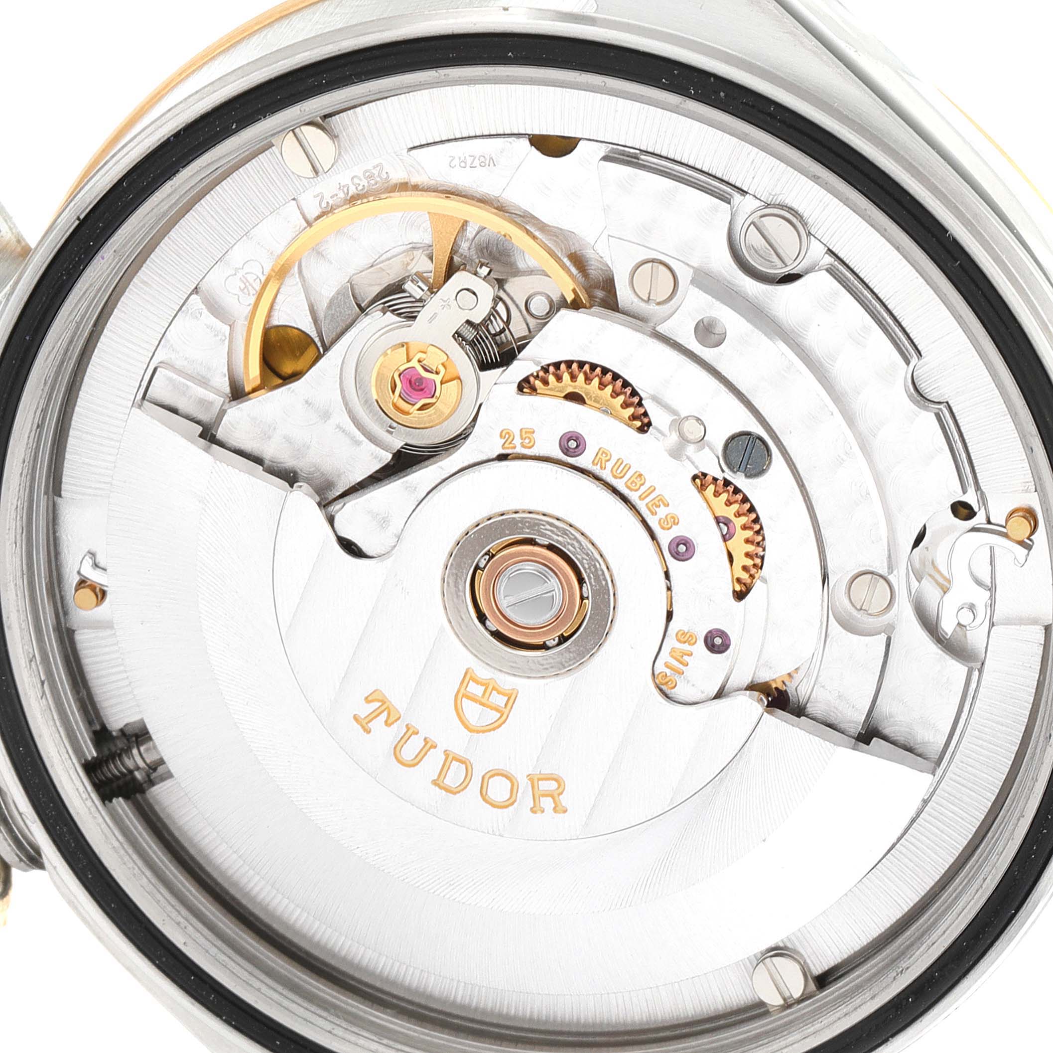 The image shows the underside of the Tudor Prince 76213 Men's Steel and Gold (two tone) Champagne Dial 76213 Men's Steel and Gold (two tone) Champagne Dial watch, revealing its intricate mechanical movement.