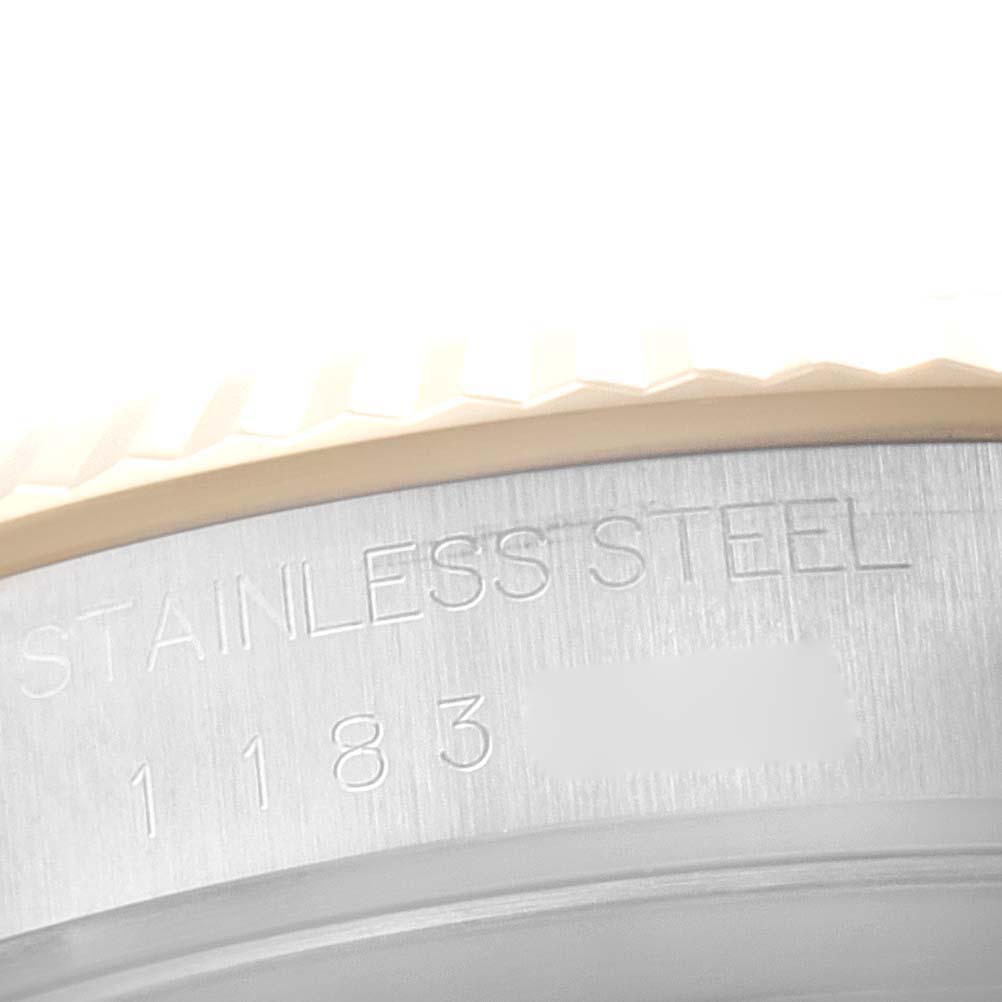 This image shows a close-up angle of the stainless steel casing and engraved serial number on the Tudor Prince 76213 Men's Steel and Gold (two tone) Silver Dial 76213 Men's Steel and Gold (two tone) Silver Dial watch.