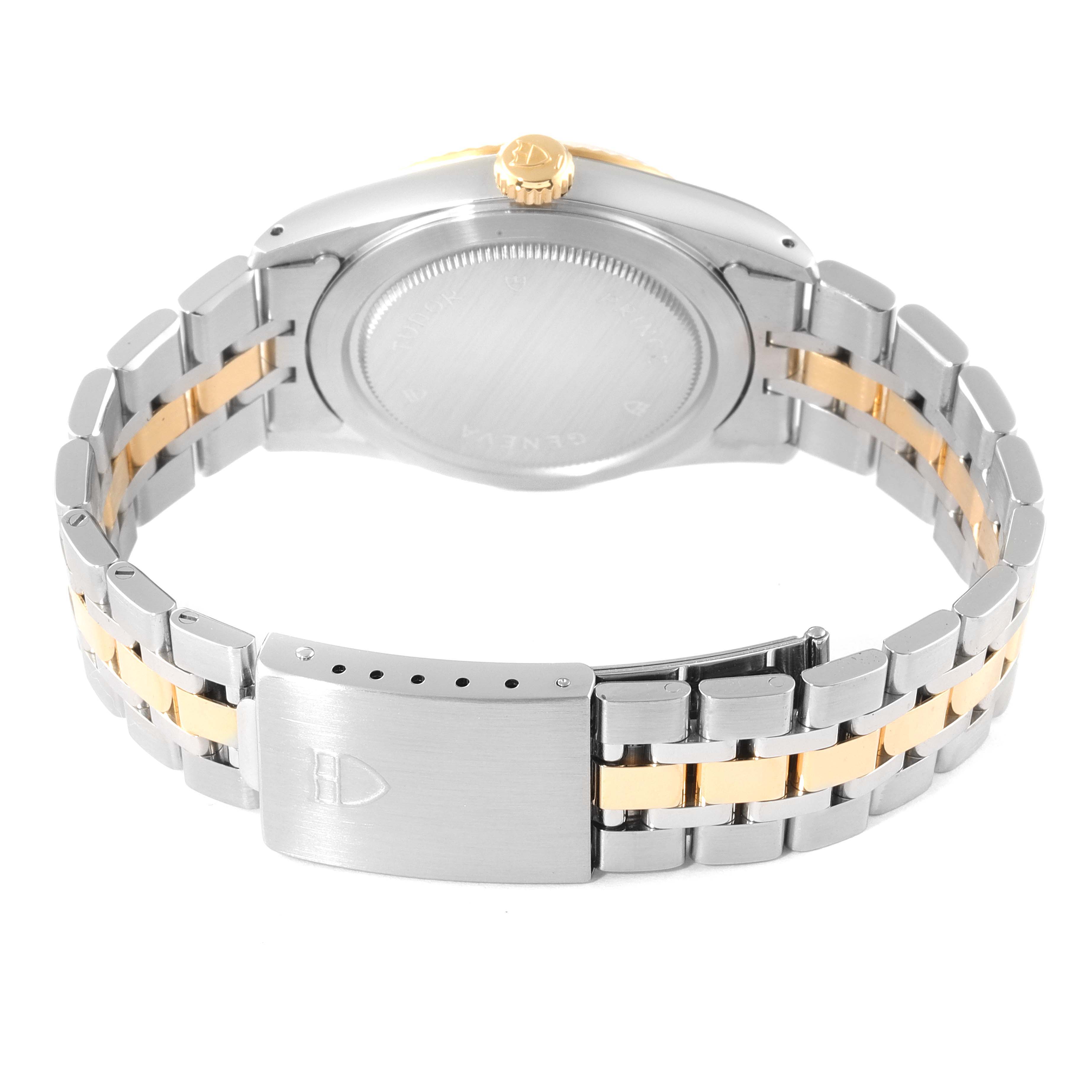 The image shows the Tudor Prince 76213 Men's Steel and Gold (two tone) Silver Dial 76213 Men's Steel and Gold (two tone) Silver Dial watch from the back, highlighting its case, crown, and metal bracelet with a folding clasp.