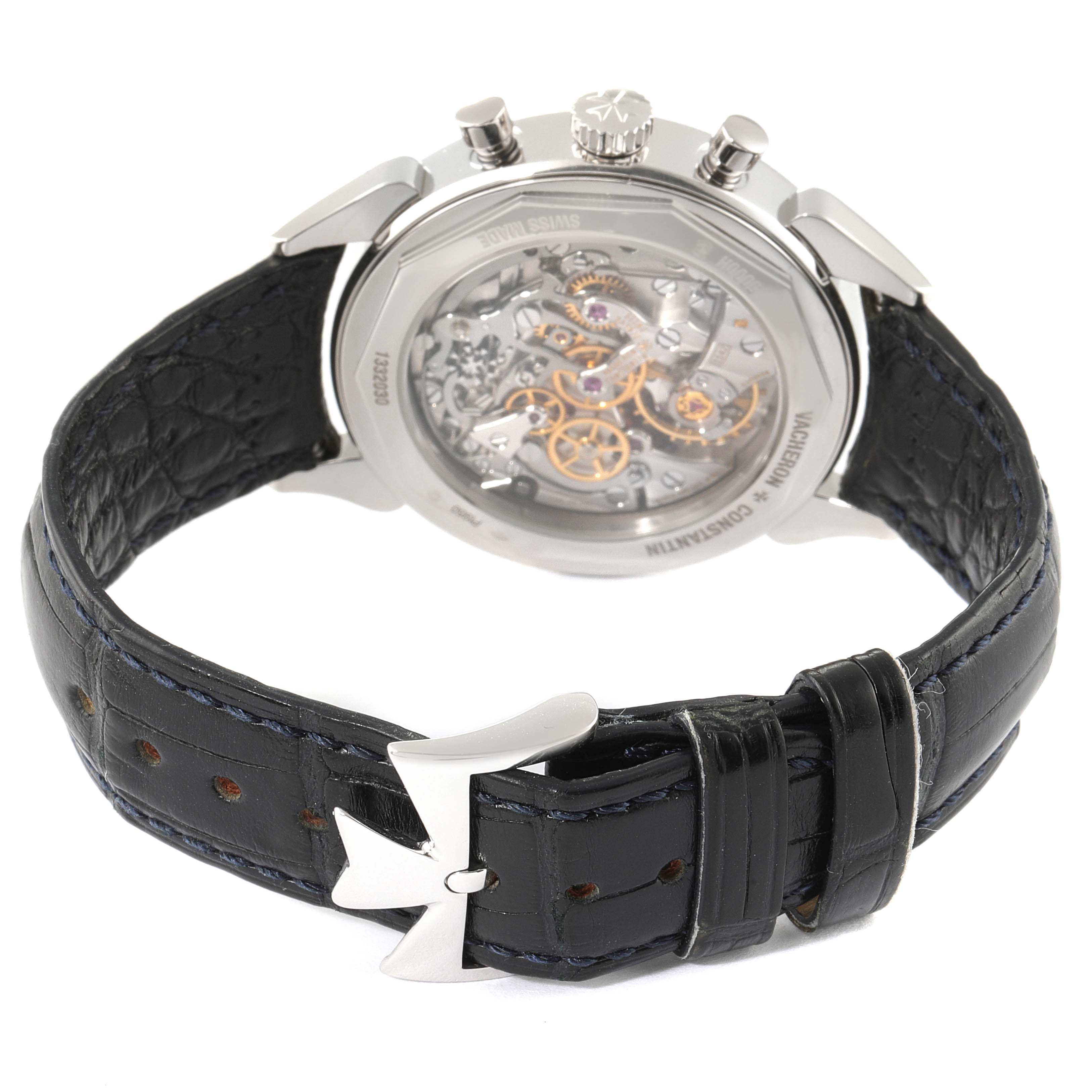 This image shows the back view of a Vintage Vacheron Constantin watch, highlighting the intricate movement and black leather strap.