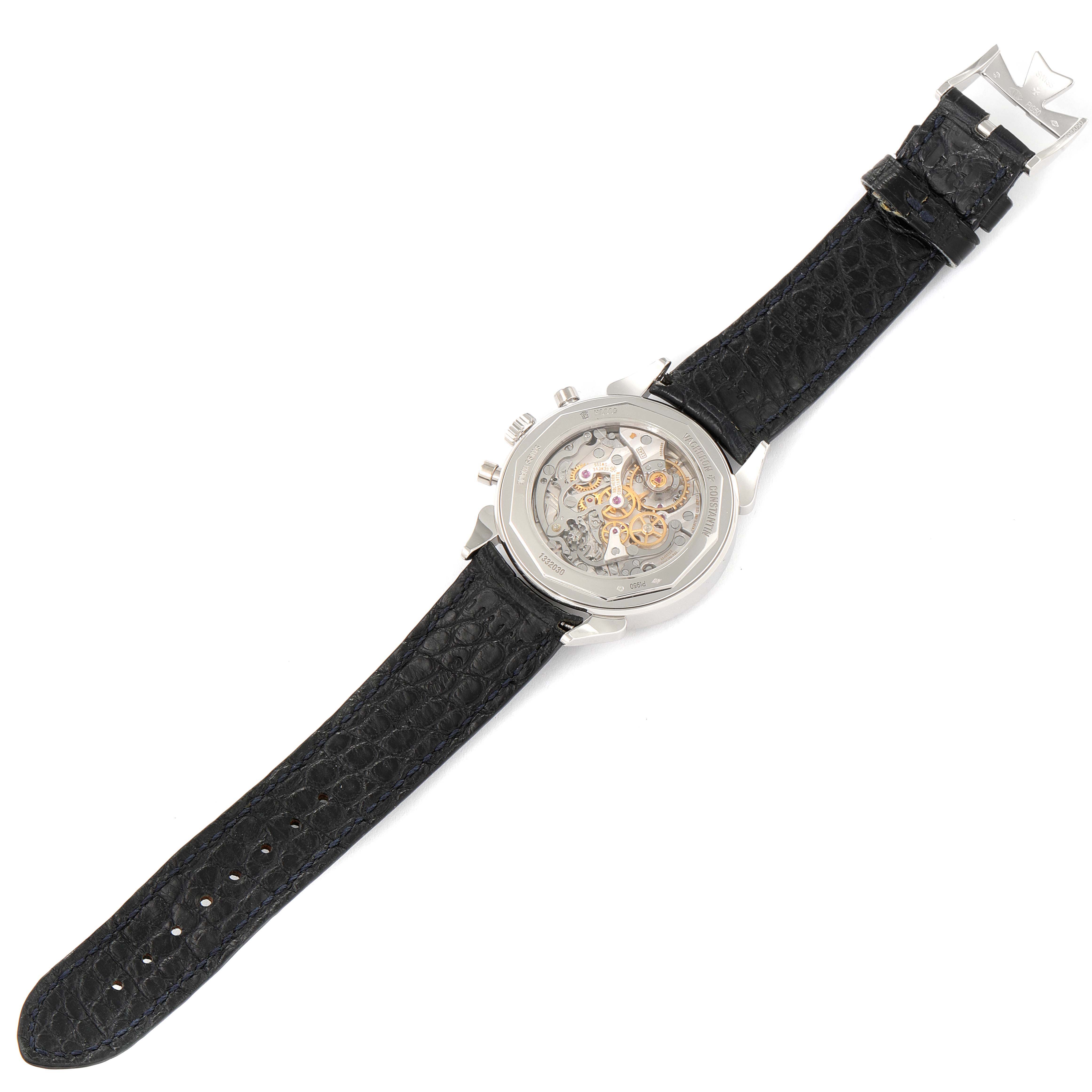 The image shows the back of a Vintage Vacheron Constantin watch with a visible mechanical movement and a black leather strap.