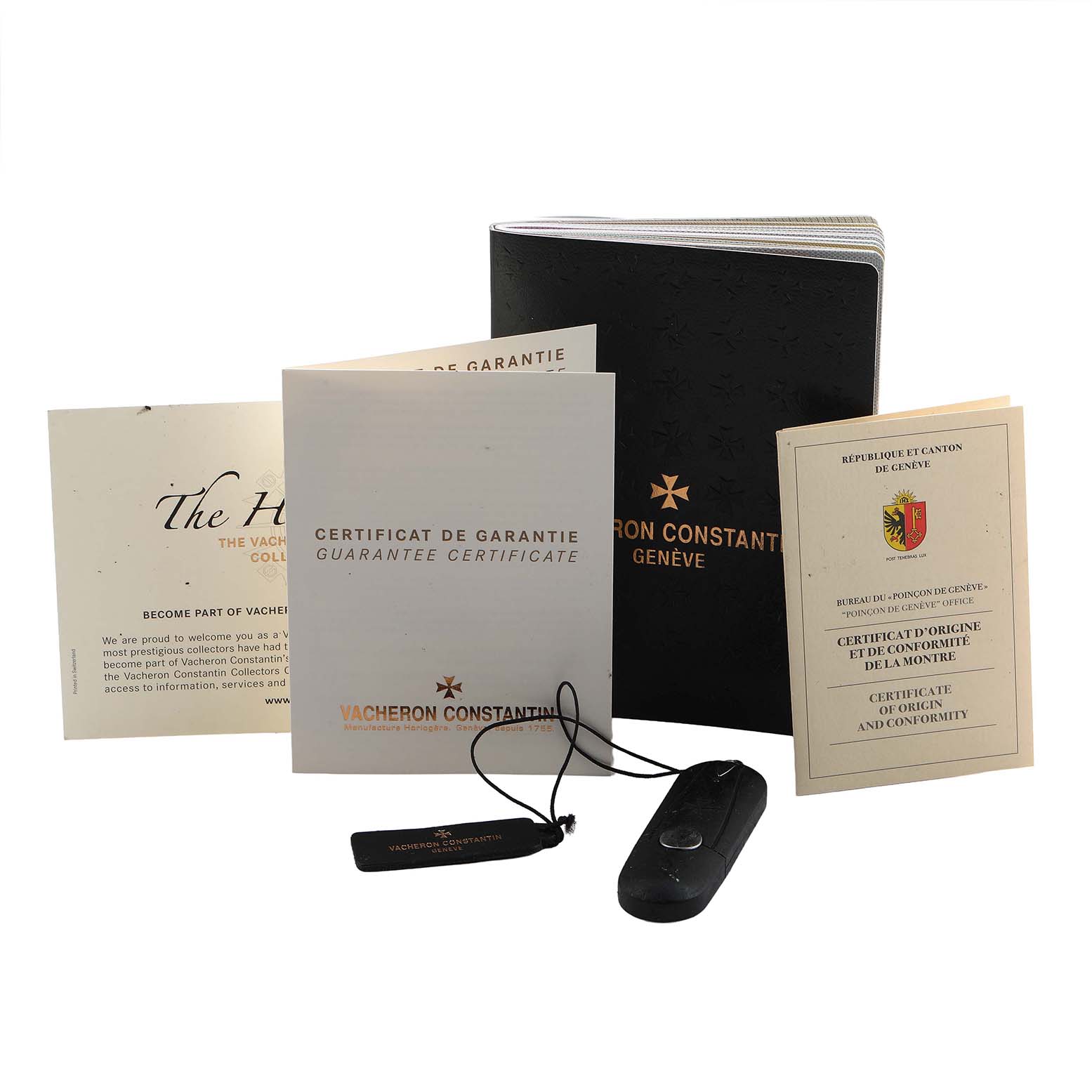 The image shows documentation and accessories, including a guarantee certificate and booklet, for the Patrimony by Vacheron Constantin.
