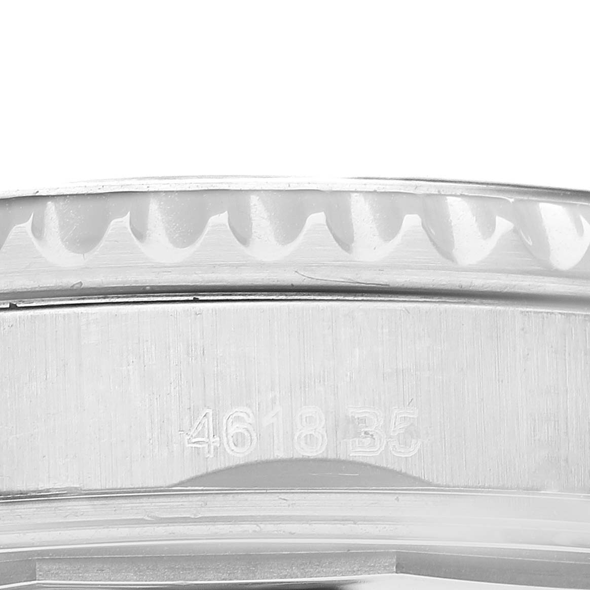 This close-up image shows the engraved case and a portion of the bezel of a Breitling Navitimer A17314 Men
s Stainless Steel Blue Dial A17314 Men
s Stainless Steel Blue Dial watch.