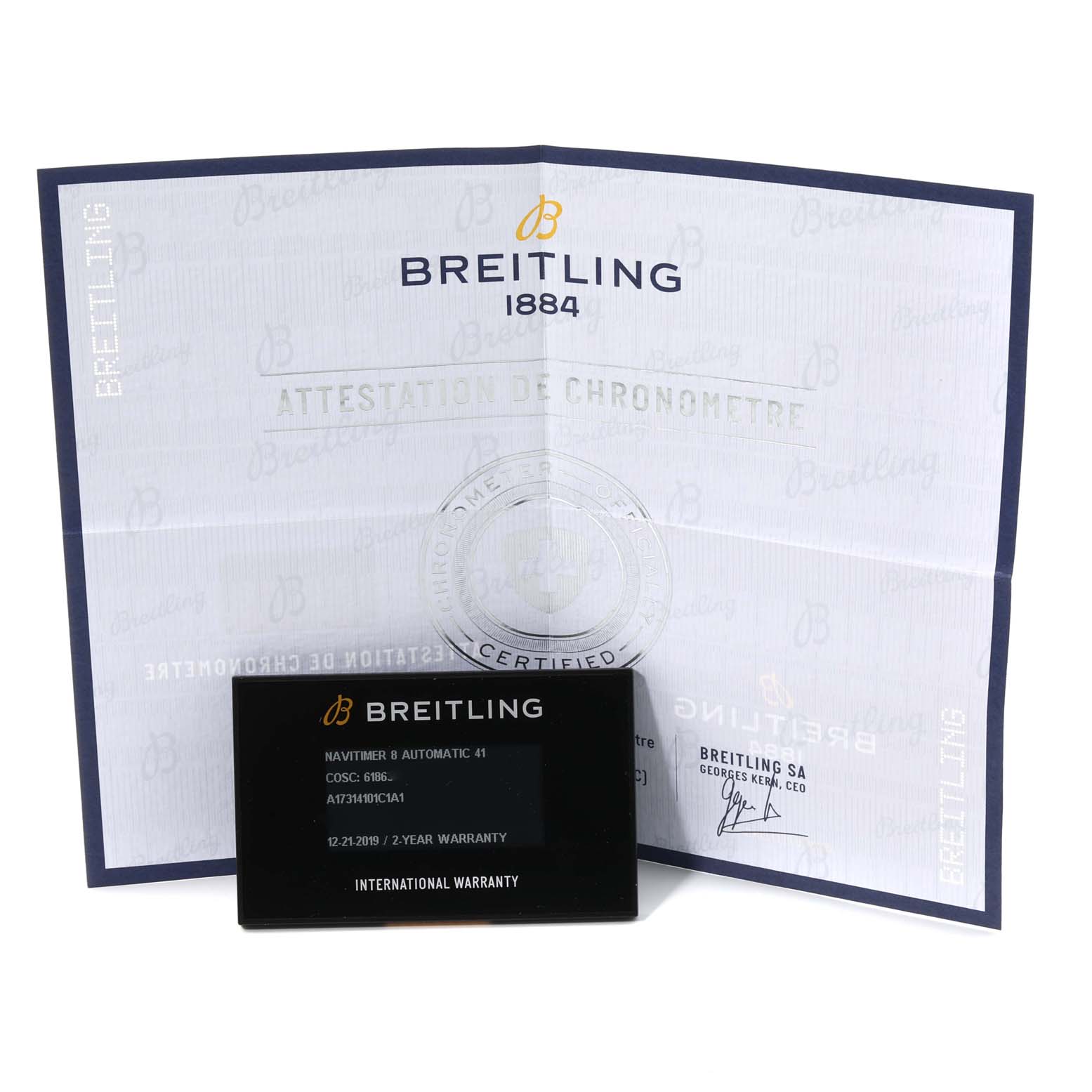 The image shows the warranty card and chronometer certification for a Breitling Navitimer A17314 Men
s Stainless Steel Blue Dial A17314 Men
s Stainless Steel Blue Dial B model.