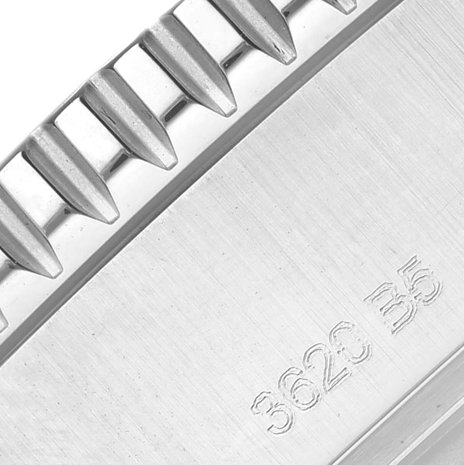 The image shows a macro view of the bezel and case side of a Breitling Superocean A17367 Men's Stainless Steel Yellow Dial A17367 Men's Stainless Steel Yellow Dial watch, highlighting its ridged edge and engraved depth rating.