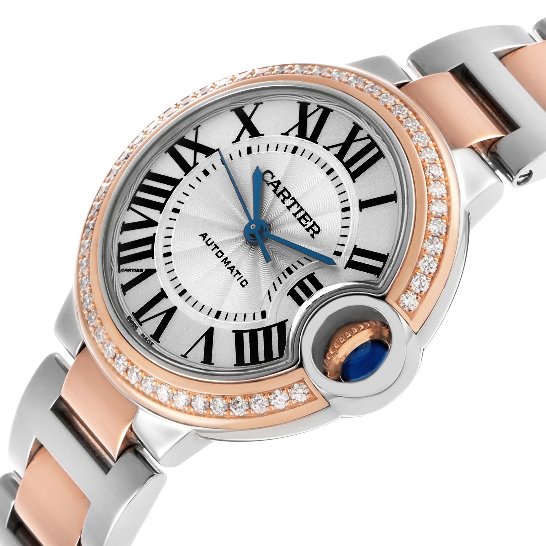 The Cartier Ballon Bleu WE902080 Women's Steel and Gold (two tone) Silver Dial watch is shown at an angled top-down view, highlighting the dial, bezel, and part of the bracelet.