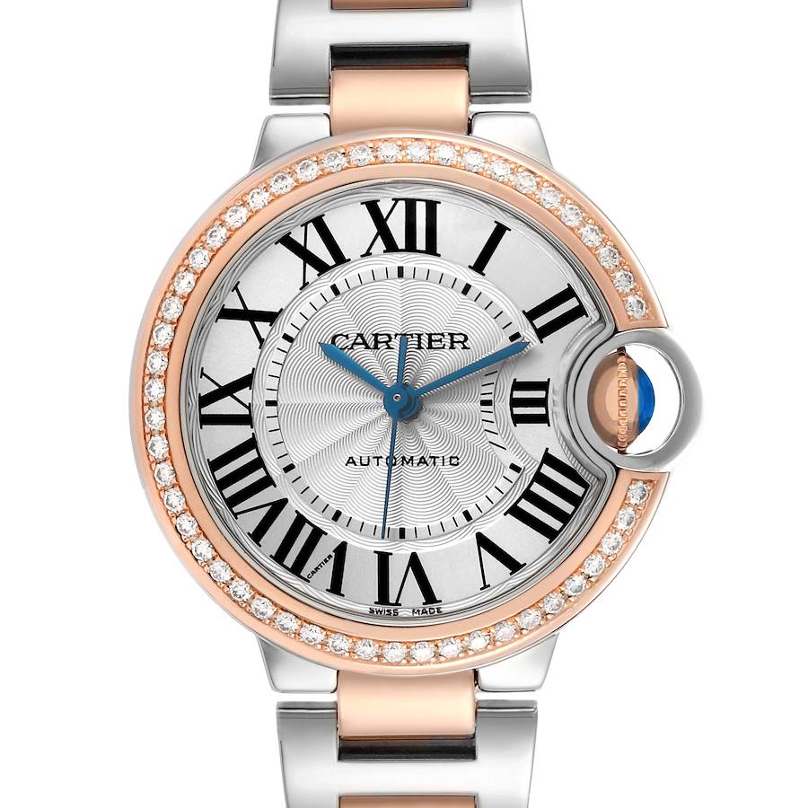 The Cartier Ballon Bleu WE902080 Women's Steel and Gold (two tone) Silver Dial watch is shown from the front, highlighting its round face, Roman numerals, and diamond bezel.