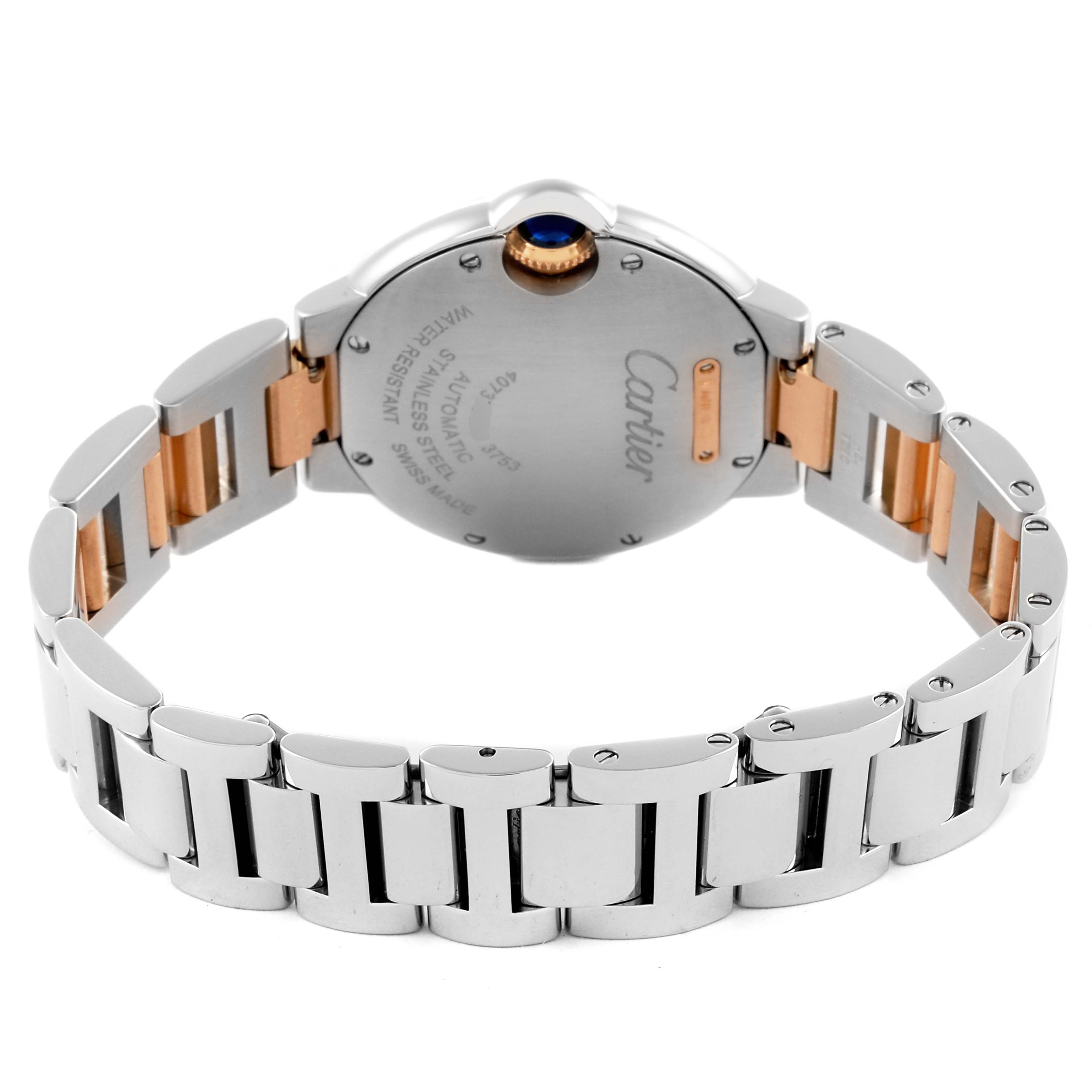 The Cartier Ballon Bleu W2BB0023 Women
s Steel and Gold (two tone) Silver Dial W2BB0023 Women
s Steel and Gold (two tone) Silver Dial watch is shown from the back, highlighting its stainless steel bracelet and engraved case back.