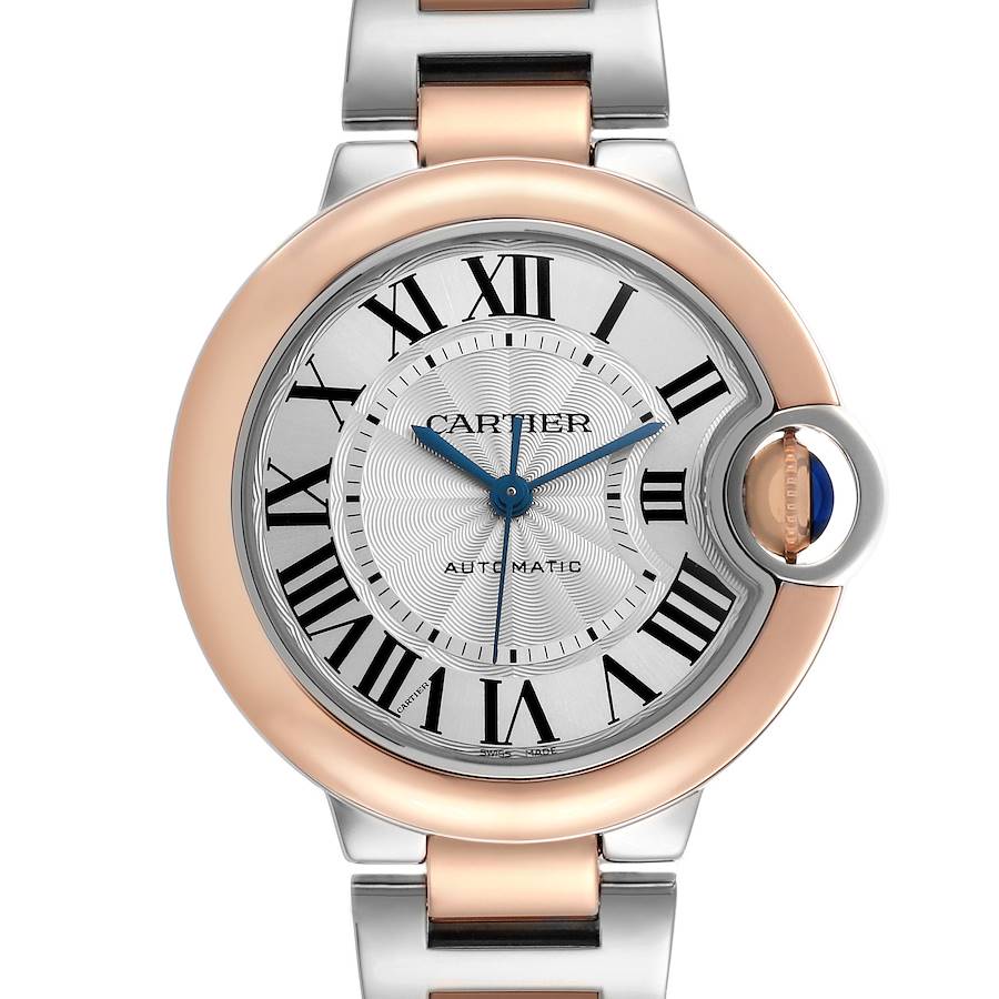 The Cartier Ballon Bleu watch is shown from a top view, displaying the face, crown, and upper bracelet links.