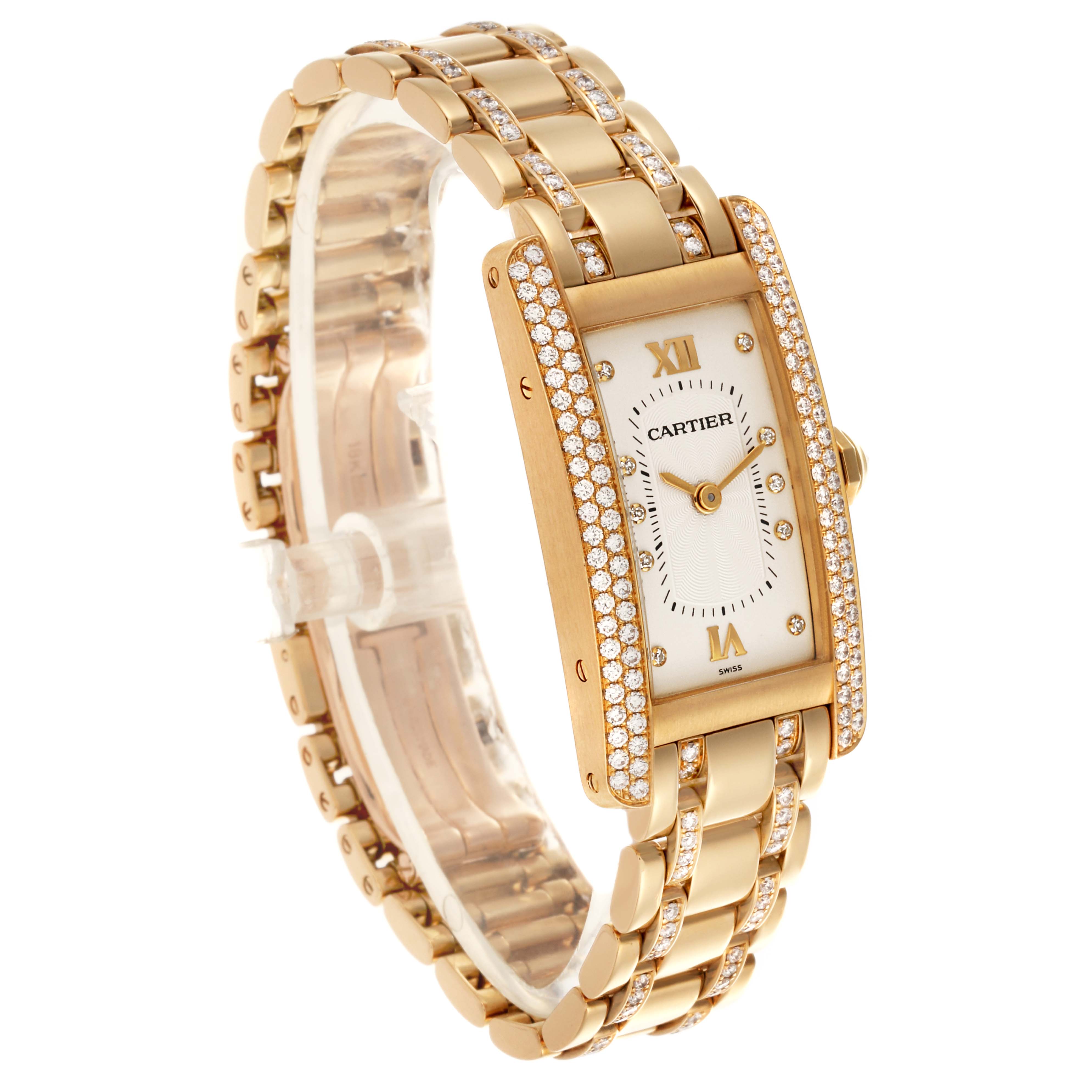 The Cartier Tank Americaine WB7025JL Women's Yellow Gold Silver Dial WB7025JL Women's Yellow Gold Silver Dial watch is shown at an angle highlighting its gold bracelet, rectangular face, and diamond-encrusted bezel.