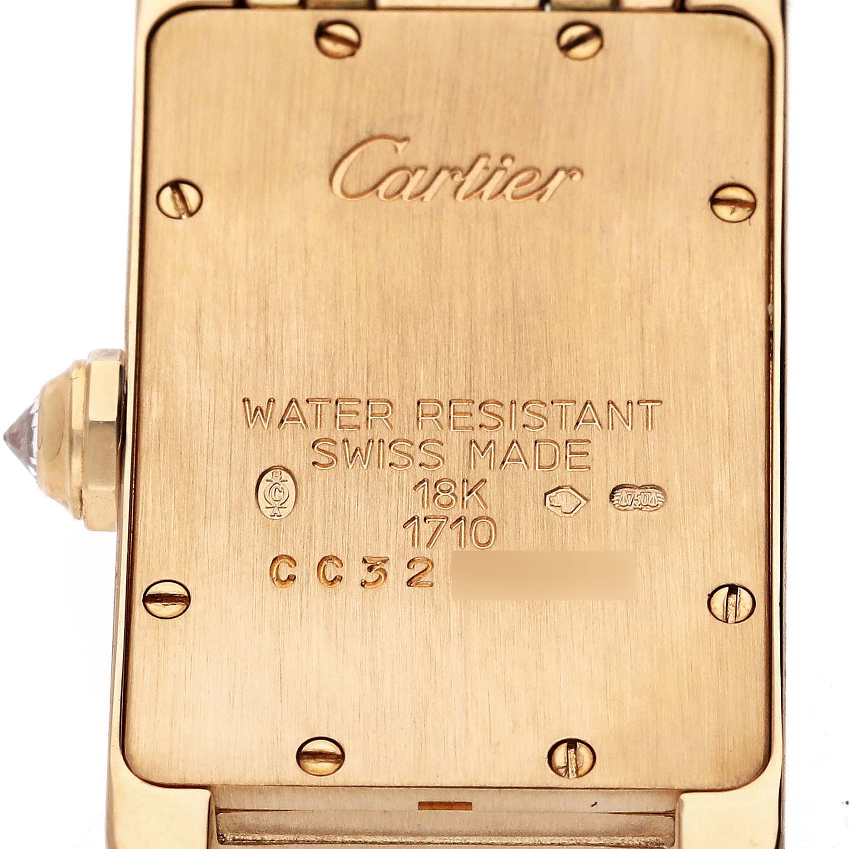 The image shows the back of a Cartier Tank Americaine WB7025JL Women's Yellow Gold Silver Dial WB7025JL Women's Yellow Gold Silver Dial watch, detailing its water resistance and material.