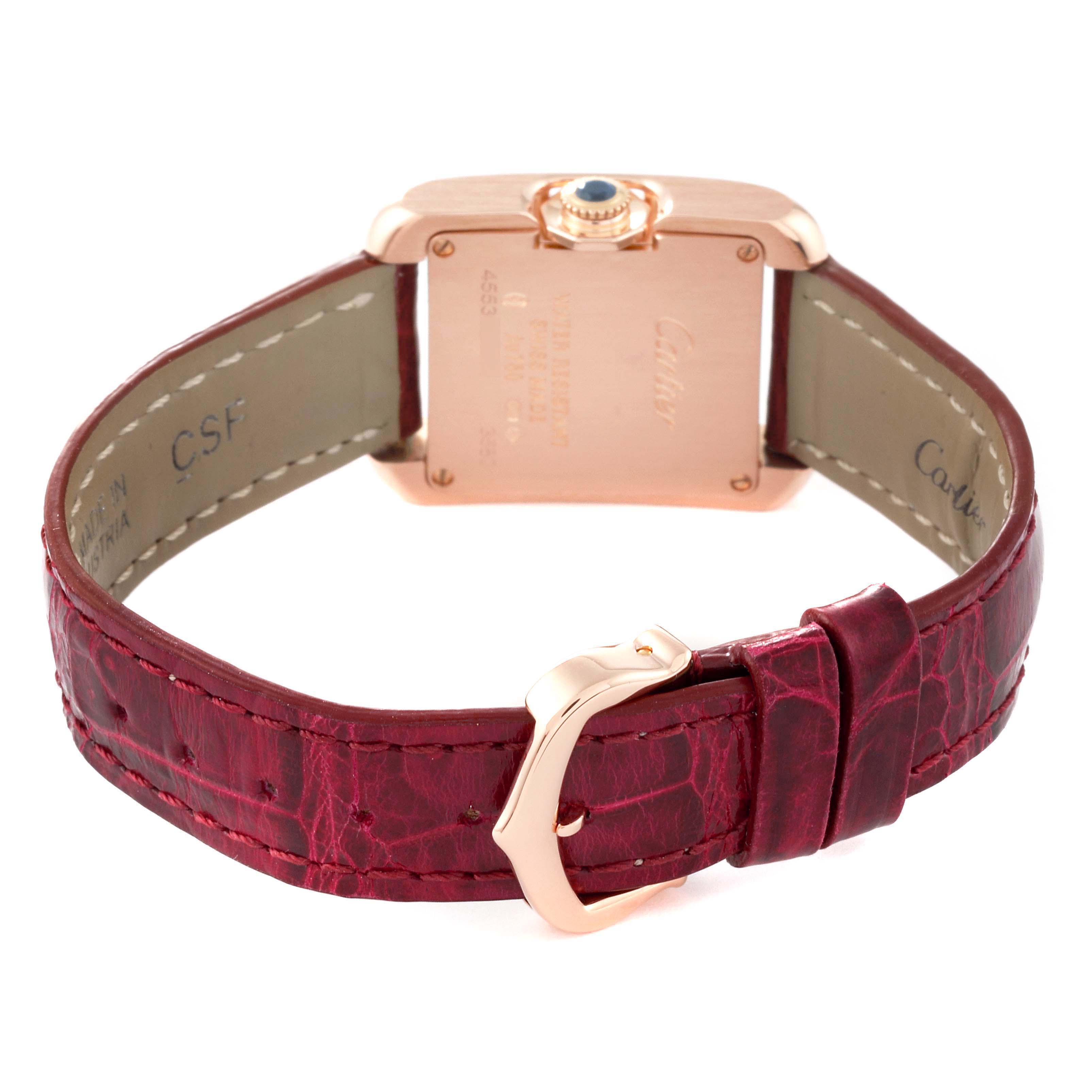 This image shows the back view of the Cartier Tank Anglaise W5310027 Women
s Rose Gold Silver Dial W5310027 Women
s Rose Gold Silver Dial watch, highlighting the case back, crown, and red leather strap.