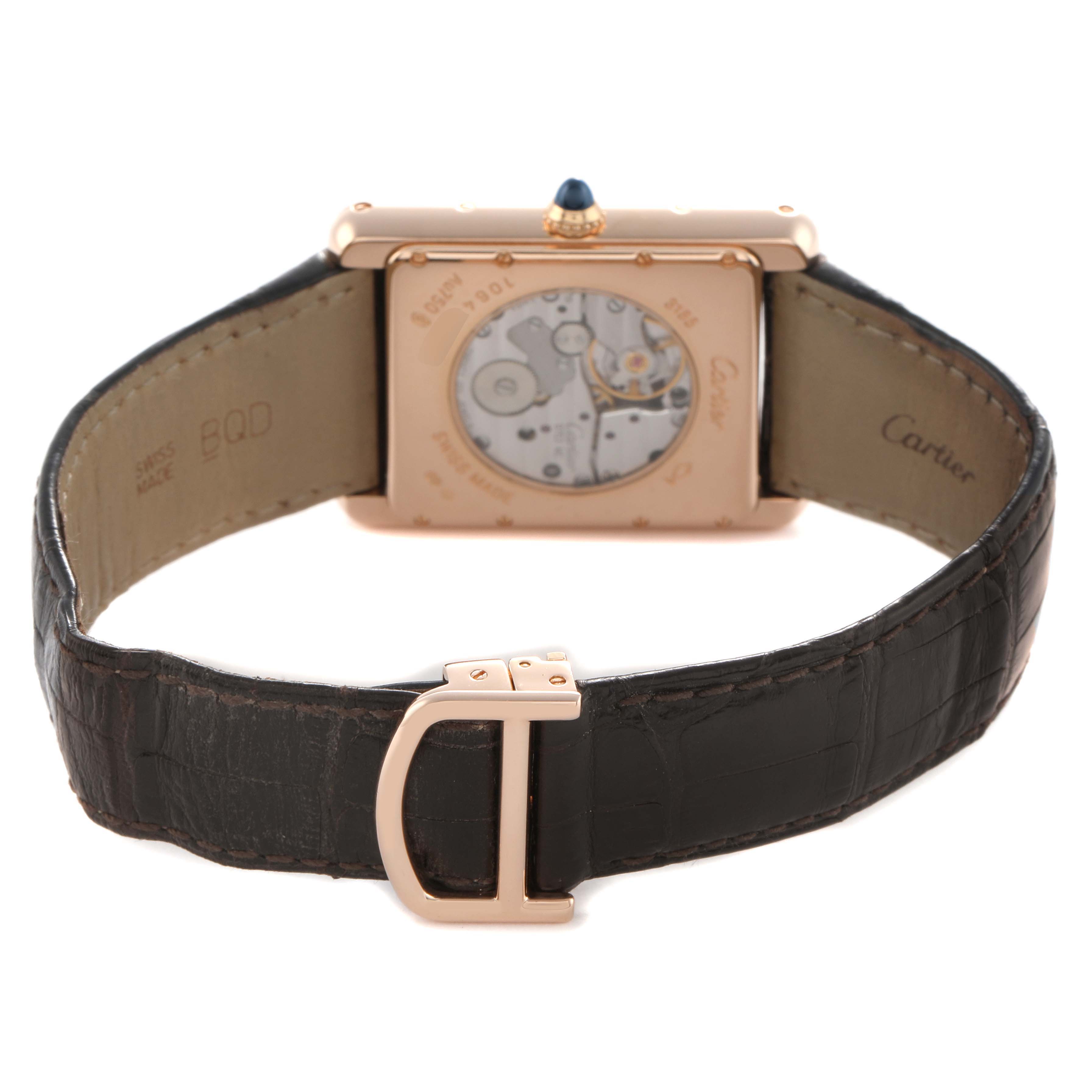The Cartier Tank Louis W1560003 Men's Rose Gold Silver Dial watch is shown from the back, displaying the movement and leather strap with a clasp.