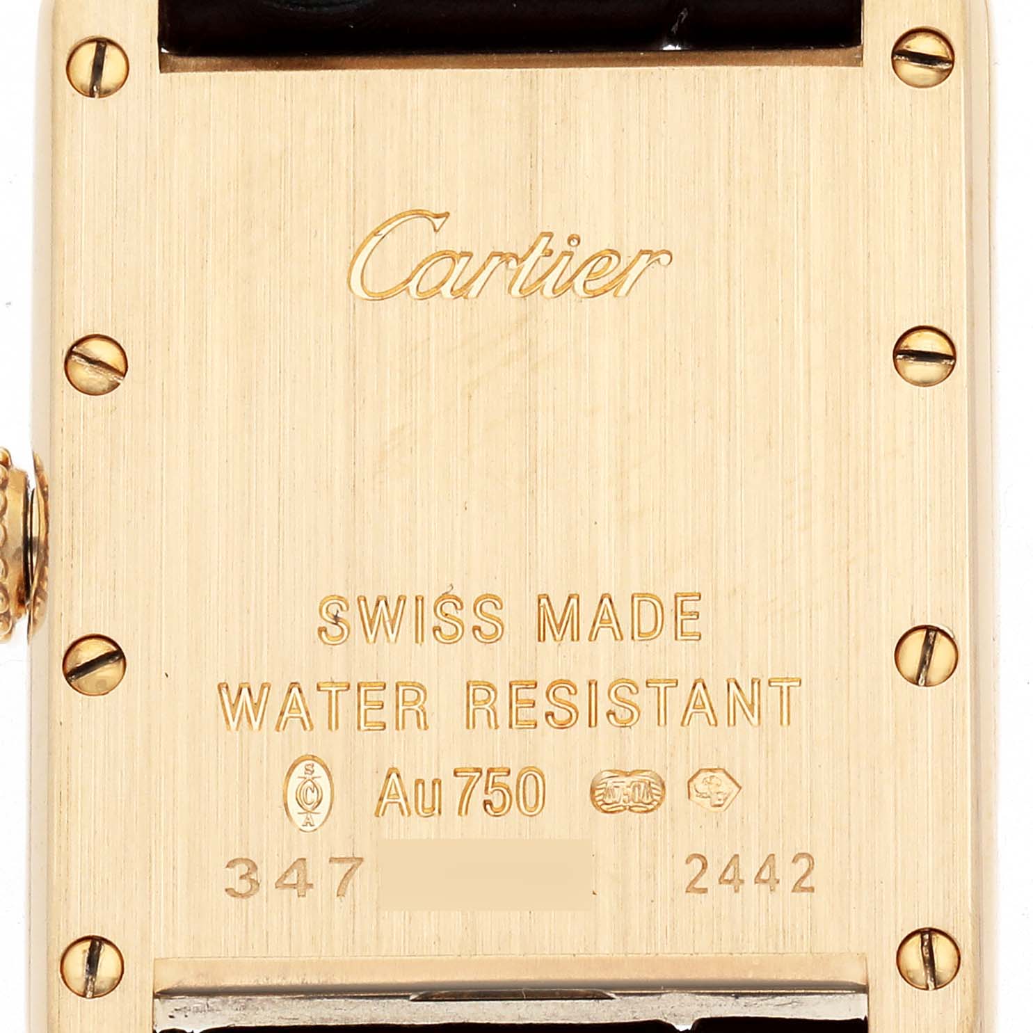 The image shows the back case of a Cartier Tank Louis W1529856 Women's Yellow Gold Silver Dial watch, highlighting engravings and screws.