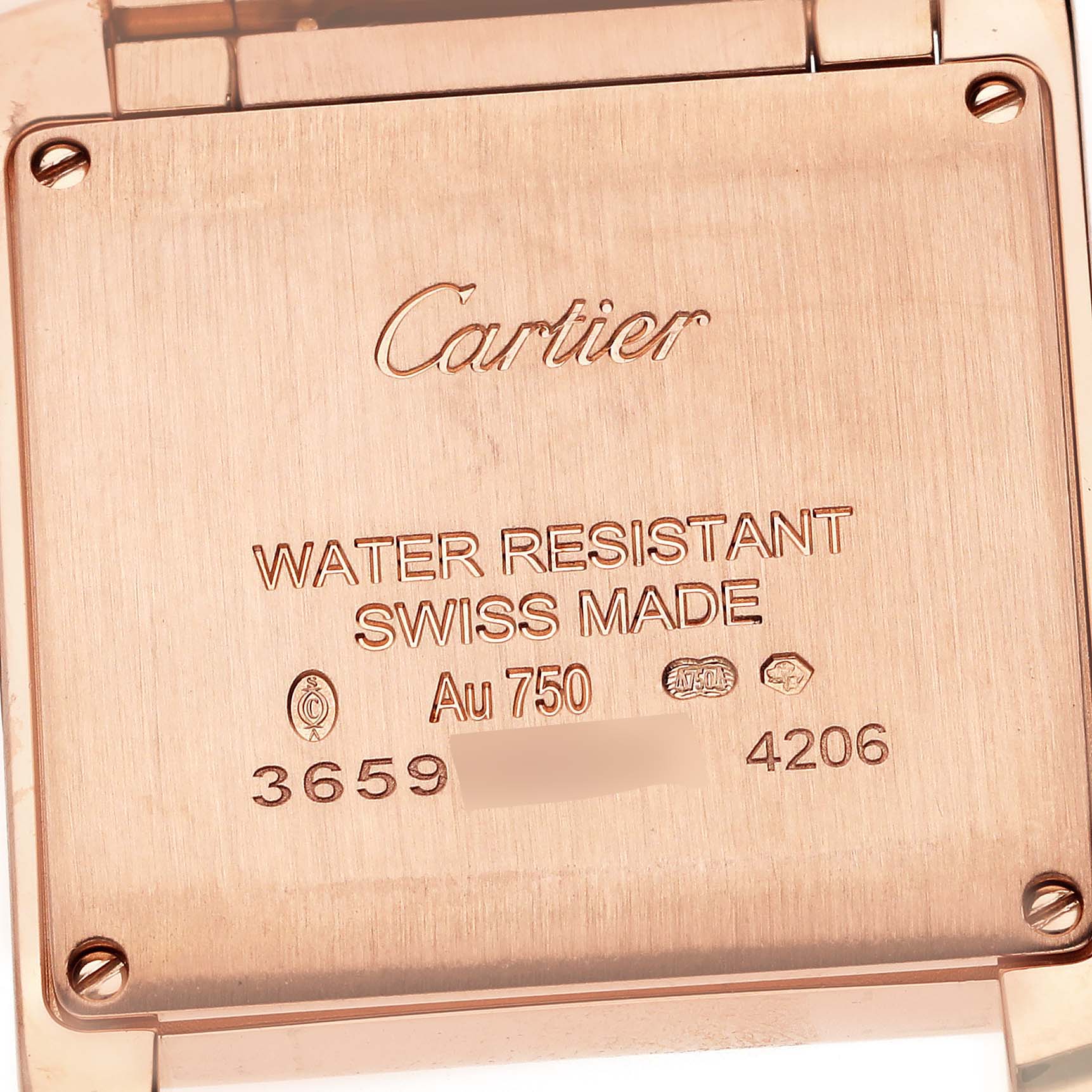 The image shows the back of the Cartier Tank Francaise WGTA0030 Women's Rose Gold White Dial WGTA0030 Women's Rose Gold White Dial watch, displaying the inscriptions and specifications.