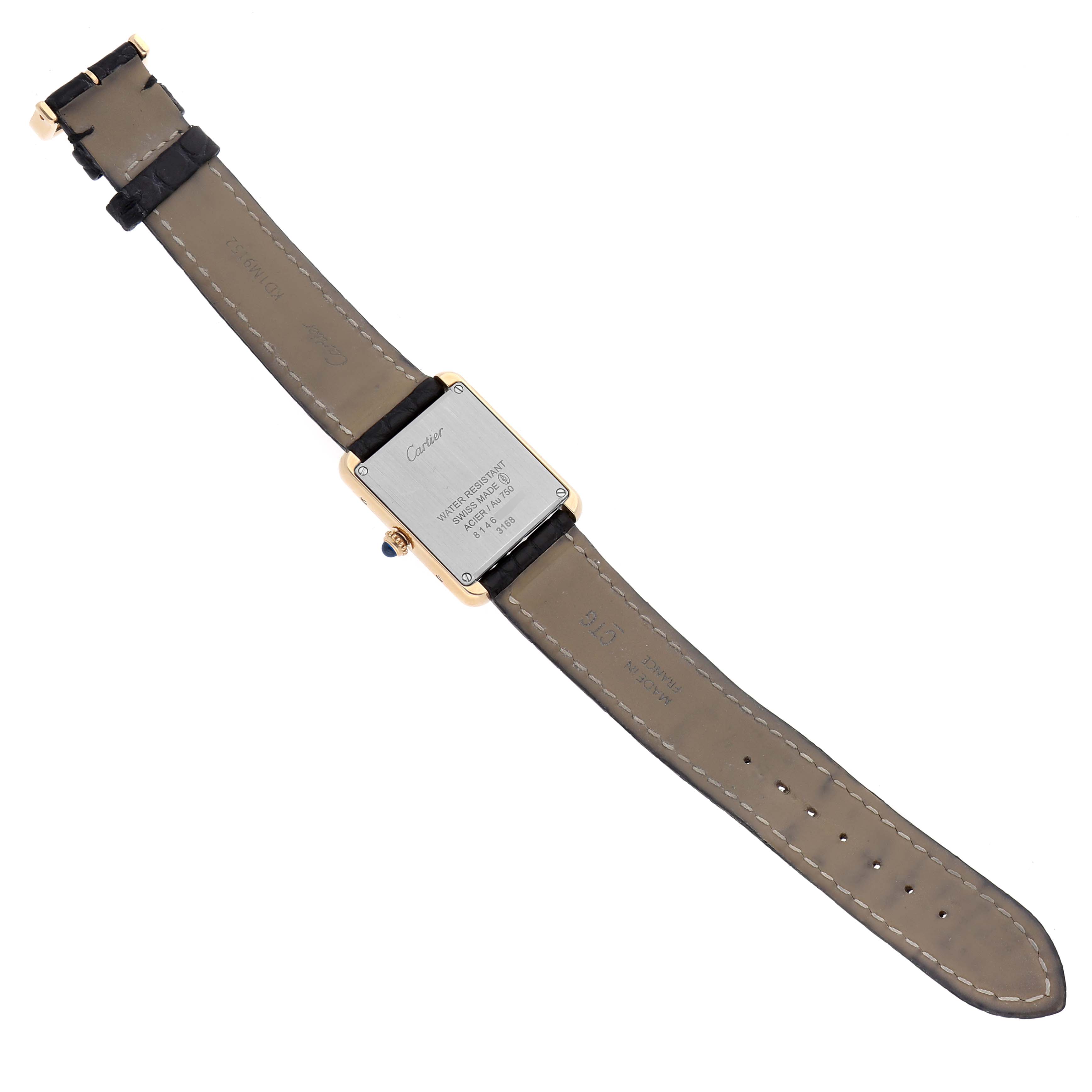 The image shows the back view of the Cartier Tank Solo W5200002 Women's Yellow Gold Silver Dial watch, displaying the case back and leather strap.