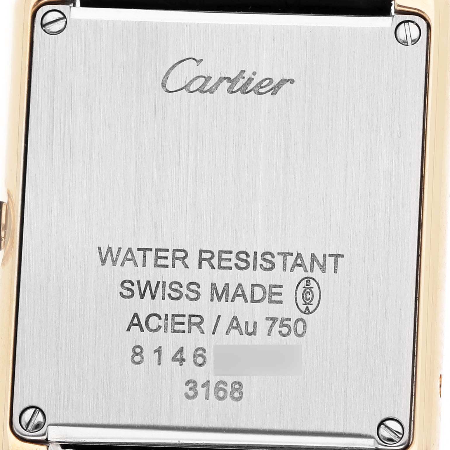 The image shows the back of the Cartier Tank Solo W5200002 Women's Yellow Gold Silver Dial watch, highlighting its engraving and water resistance details.