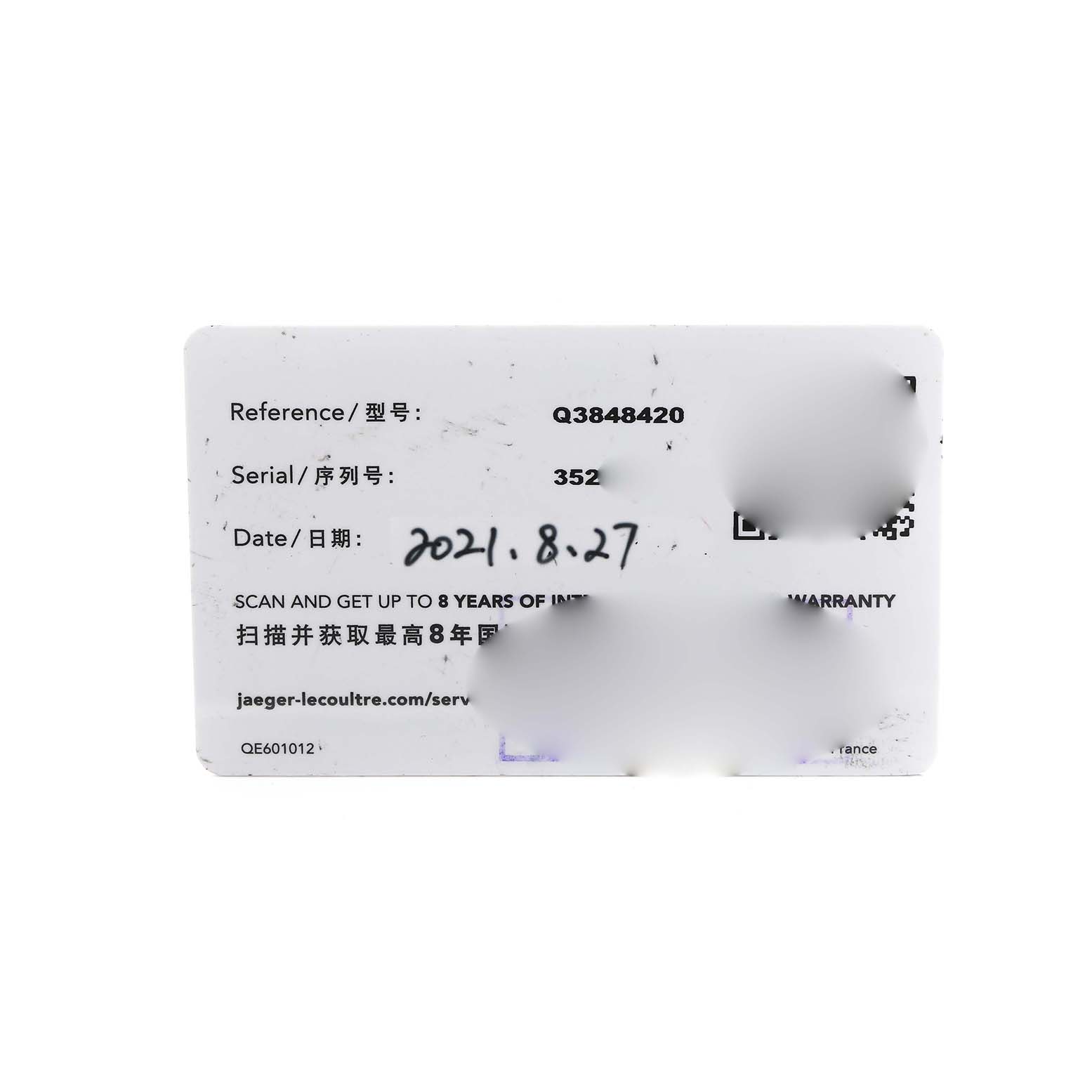 The image shows a warranty card for a Jaeger LeCoultre Reverso Q3848420 Men's Stainless Steel Silver Dial watch, featuring reference, serial information, and a date.