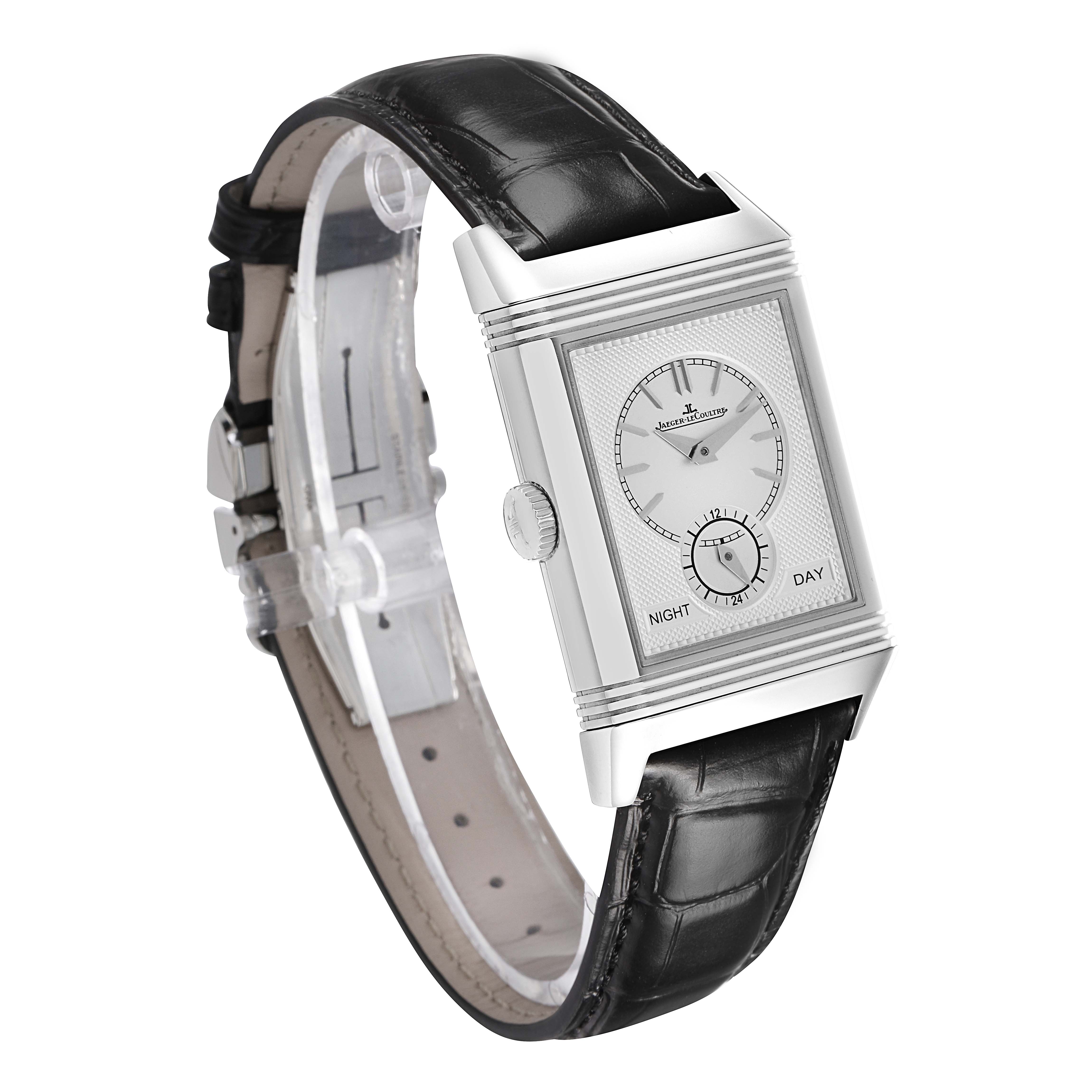 The Jaeger-LeCoultre Reverso watch is shown at an angled side view, highlighting its rectangular face and leather strap.