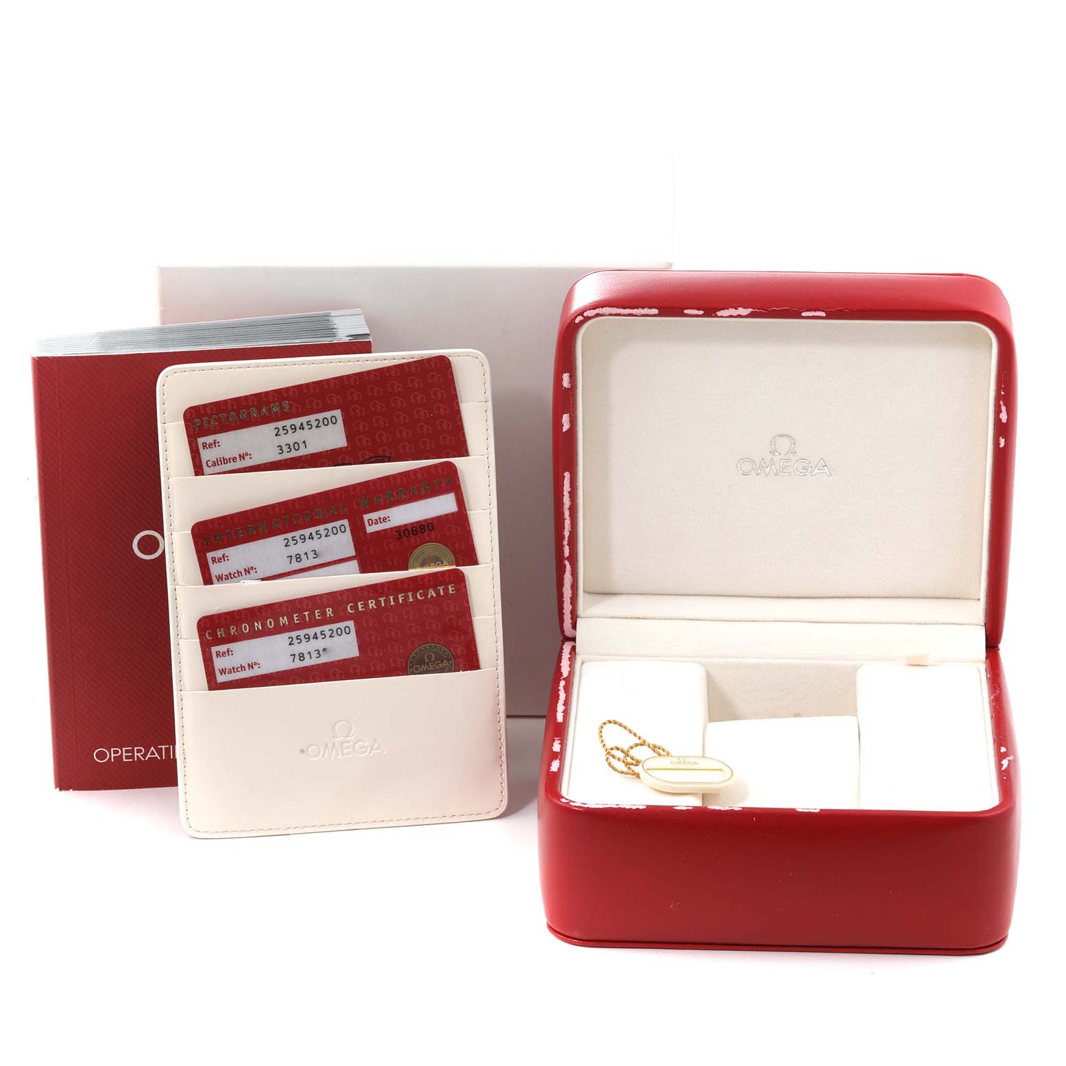 The image shows the box, papers, and warranty cards for an Omega Seamaster 2594.52.00 Men
s Stainless Steel Black Dial 2594.52.00 Men
s Stainless Steel Black Dial watch, taken from a front angle.