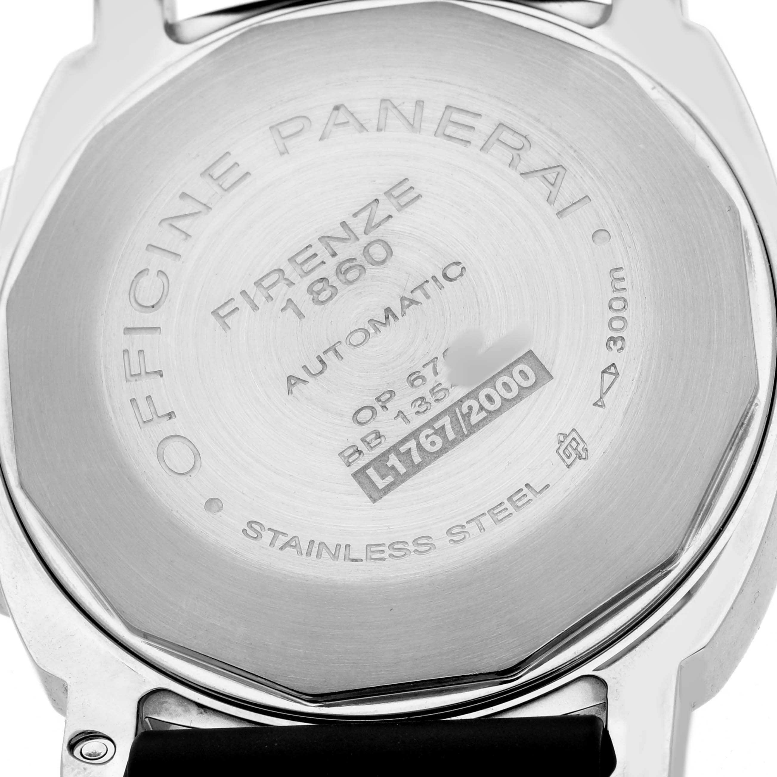 The image shows the back case of a Panerai Luminor PAM00090 Men's Stainless Steel Black Dial watch, displaying engravings for model details and materials.
