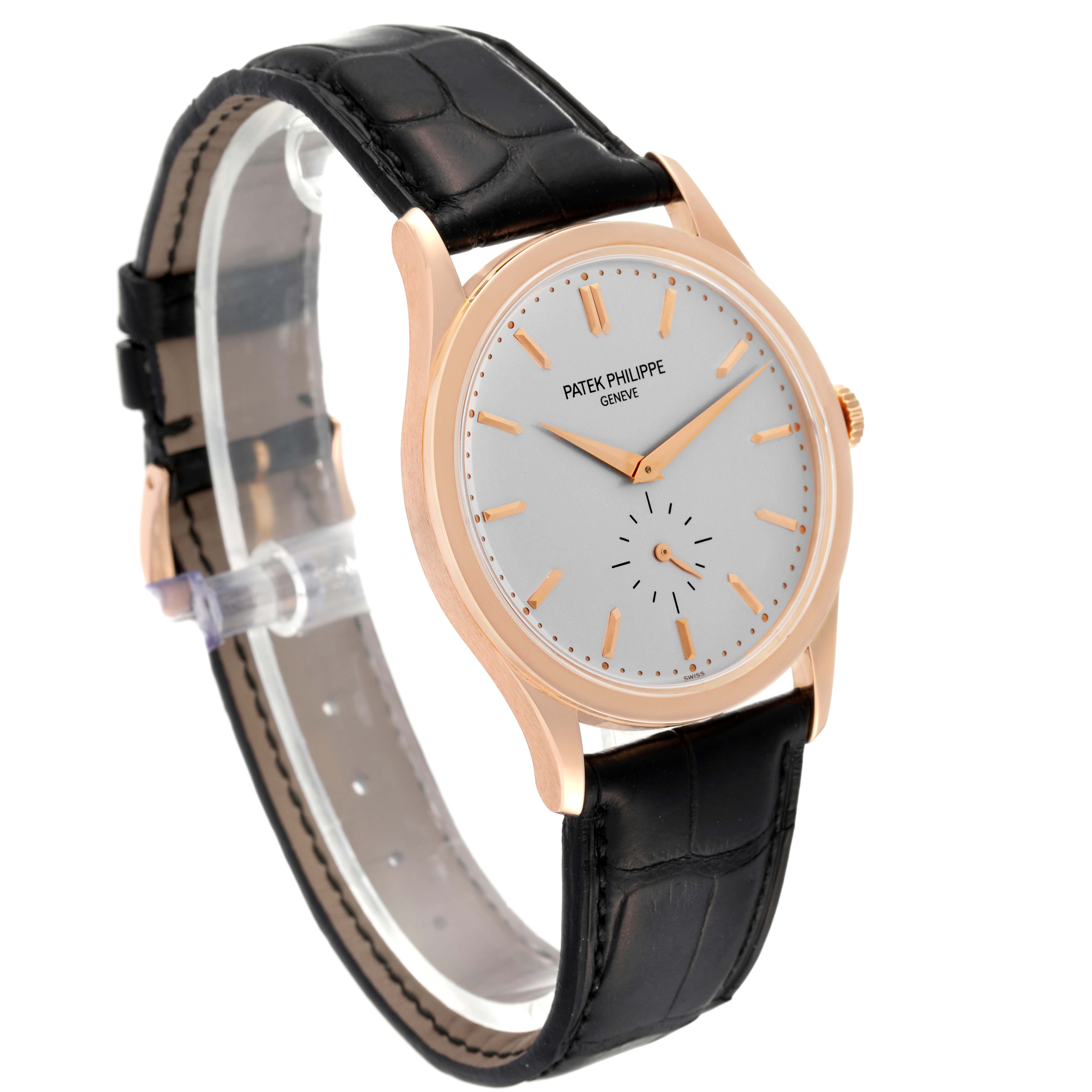 The image shows a Patek Philippe Calatrava 5196R Men
s Rose Gold Silver Dial 5196R Men
s Rose Gold Silver Dial watch at a three-quarter angle, highlighting the face, case, and black leather strap.