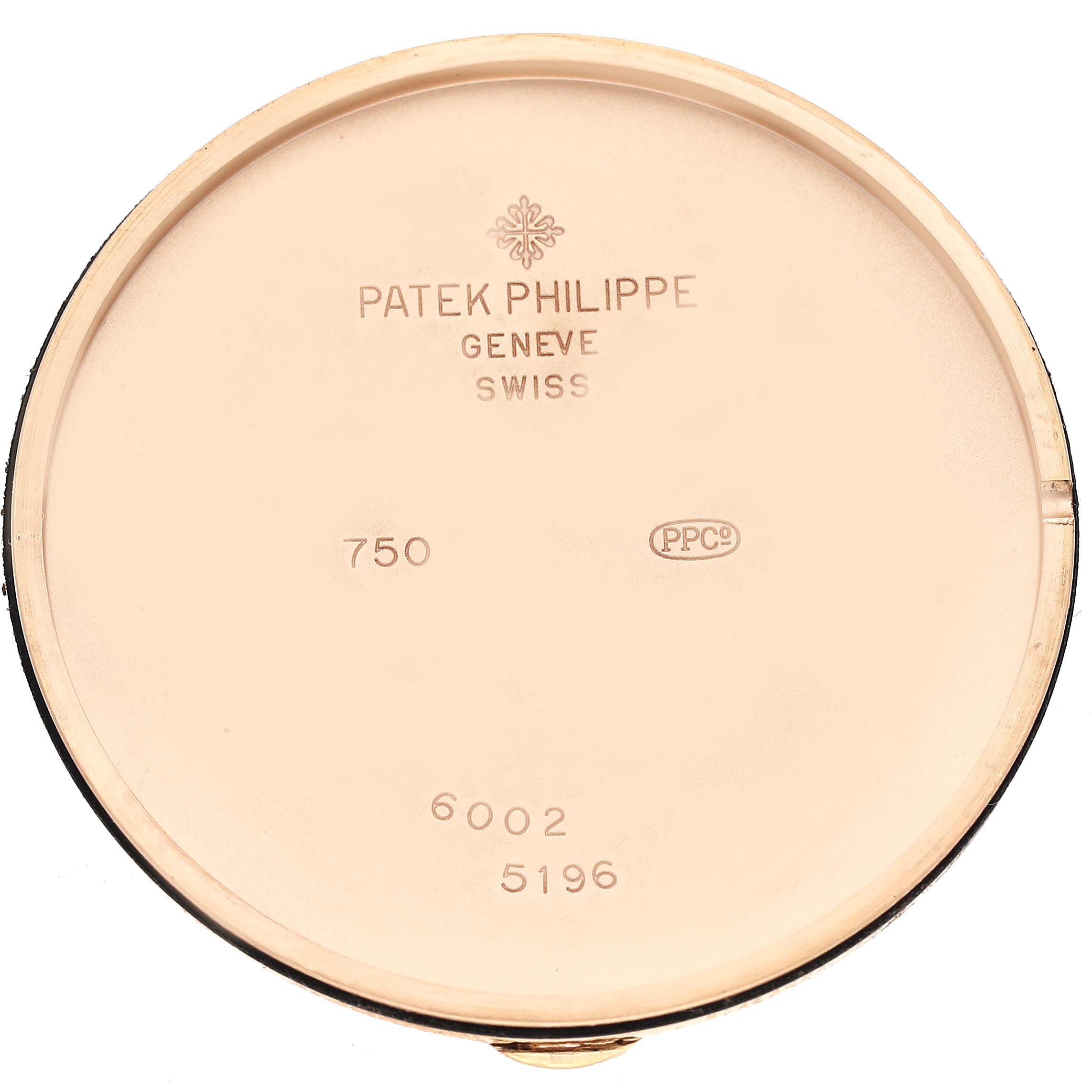 This image shows the inner case back of a Patek Philippe Calatrava 5196R Men
s Rose Gold Silver Dial 5196R Men
s Rose Gold Silver Dial watch, displaying the brand, model, and hallmark engravings.