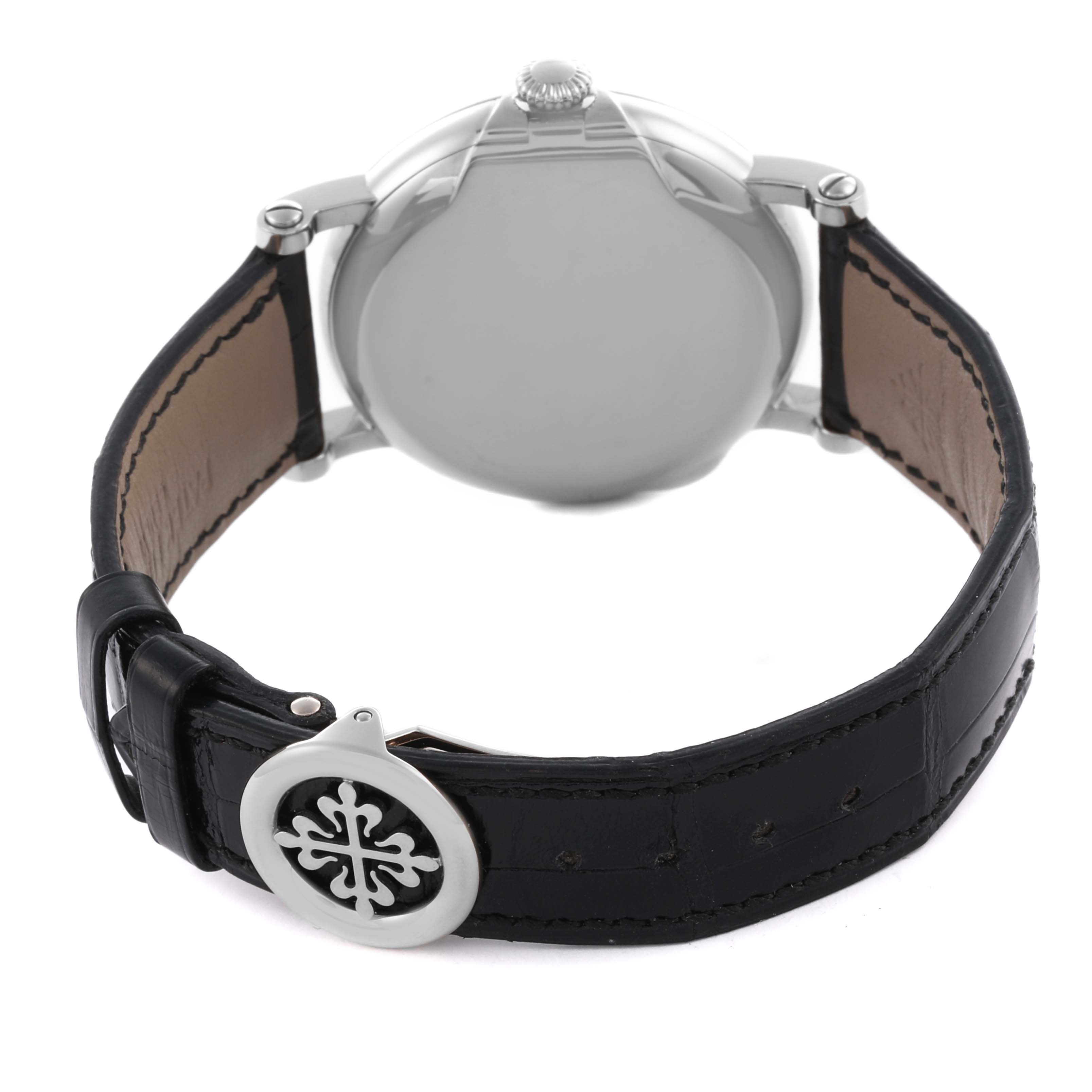 The image shows the back case and leather strap of the Patek Philippe Calatrava 5153G-010 Men
s White Gold Silver Dial 5153G-010 Men
s White Gold Silver Dial watch, showcasing the clasp with the logo.