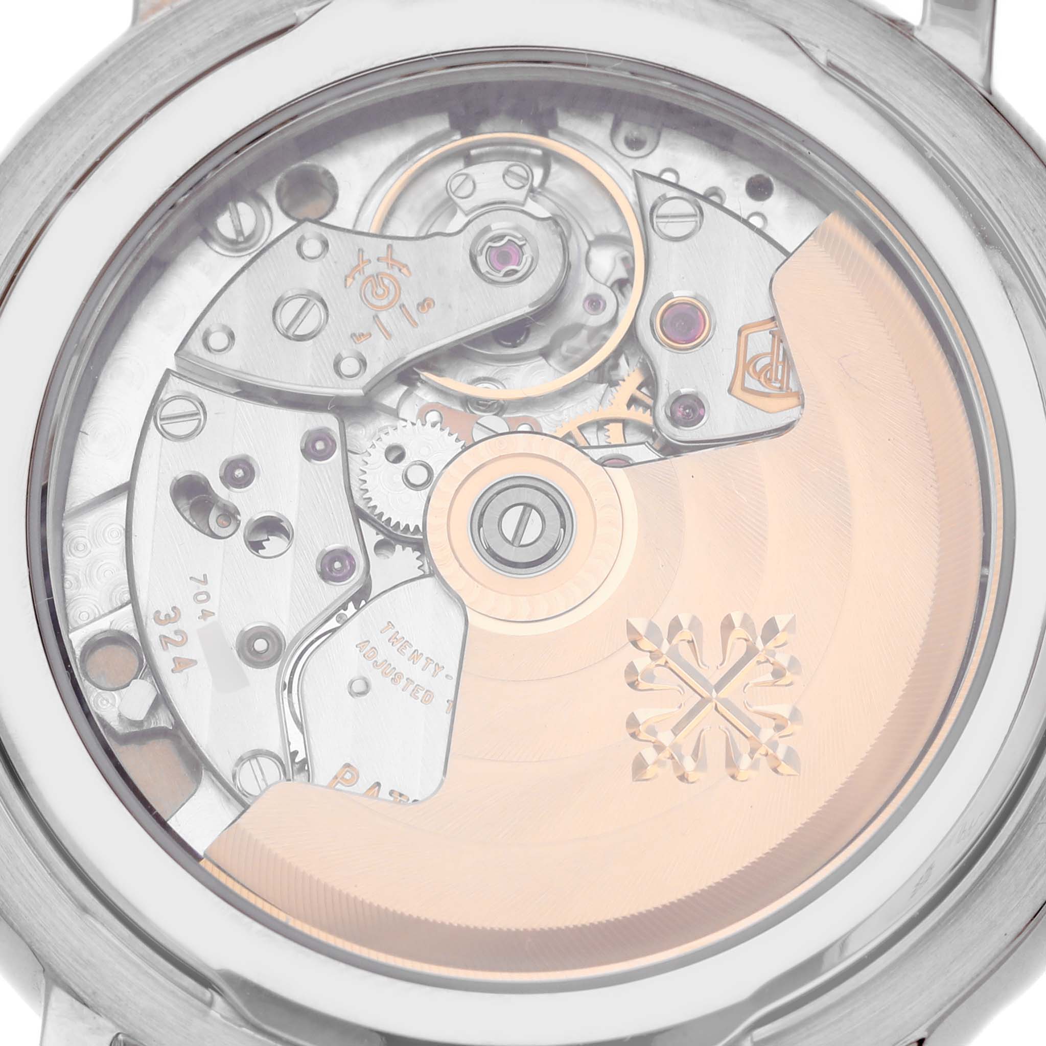 The image shows the back of a Patek Philippe Calatrava 5153G-010 Men
s White Gold Silver Dial 5153G-010 Men
s White Gold Silver Dial, focusing on its intricate movement and rotor.