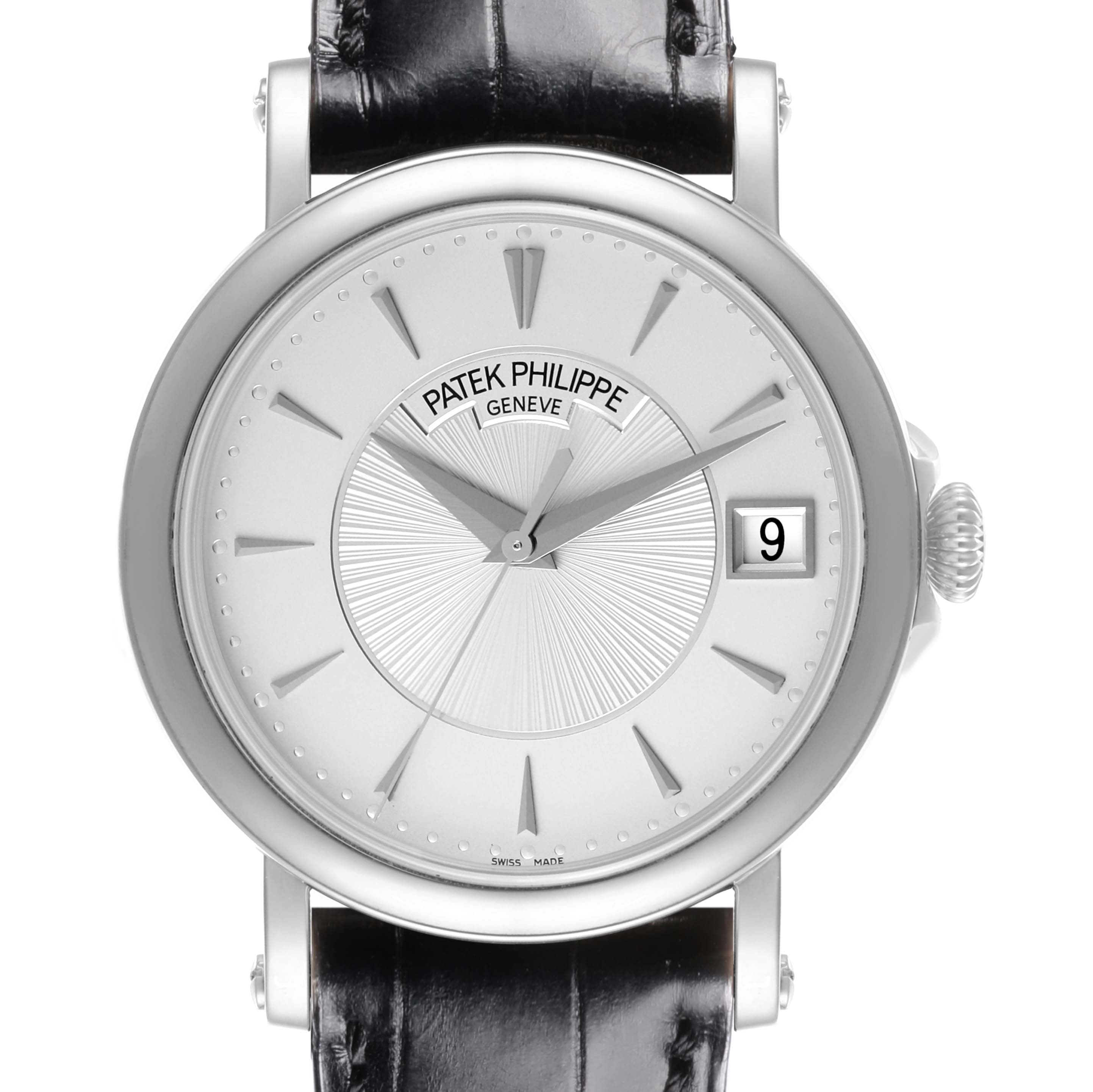 The Patek Philippe Calatrava 5153G-010 Men
s White Gold Silver Dial 5153G-010 Men
s White Gold Silver Dial watch is shown from a front angle, highlighting the dial, hands, and date window.