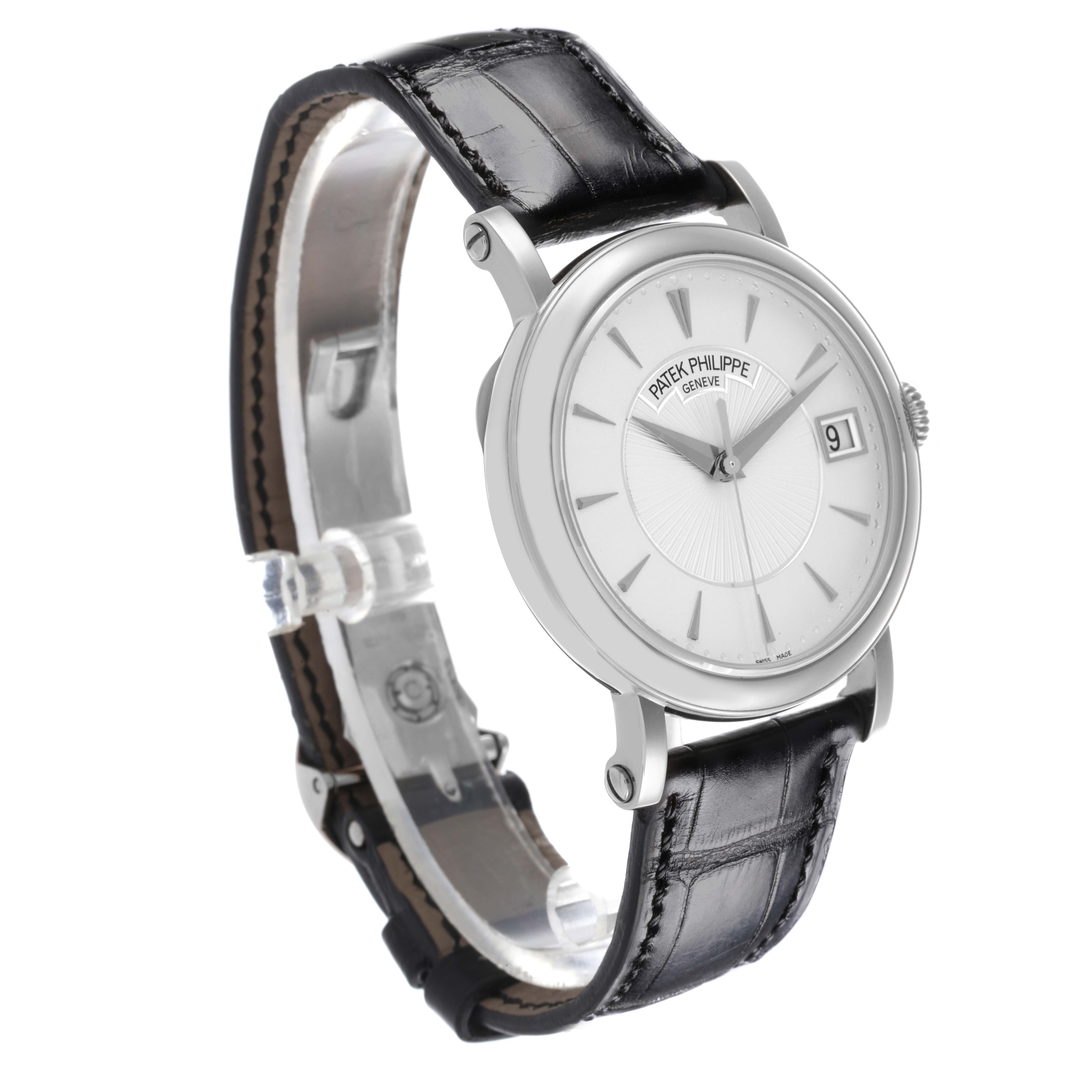 The Patek Philippe Calatrava 5153G-010 Men
s White Gold Silver Dial 5153G-010 Men
s White Gold Silver Dial is shown at a three-quarter angle, displaying the watch face, side case, and leather strap.